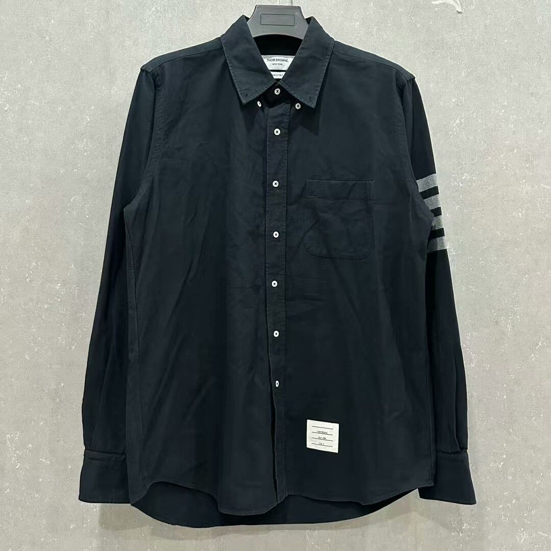 navy four-stripe shirt by Thom Browne