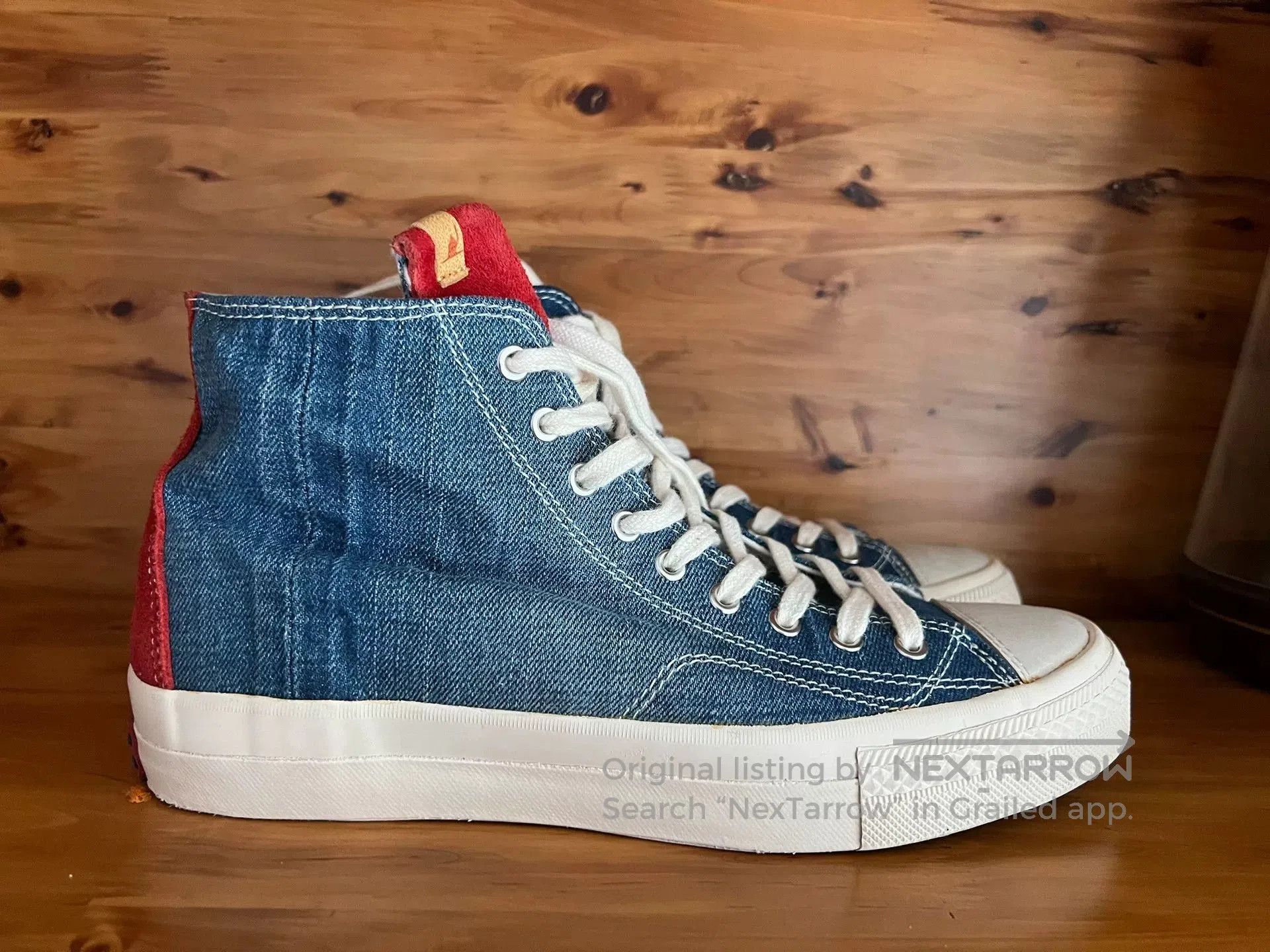 visvim high-top denim sneakers with red accents.