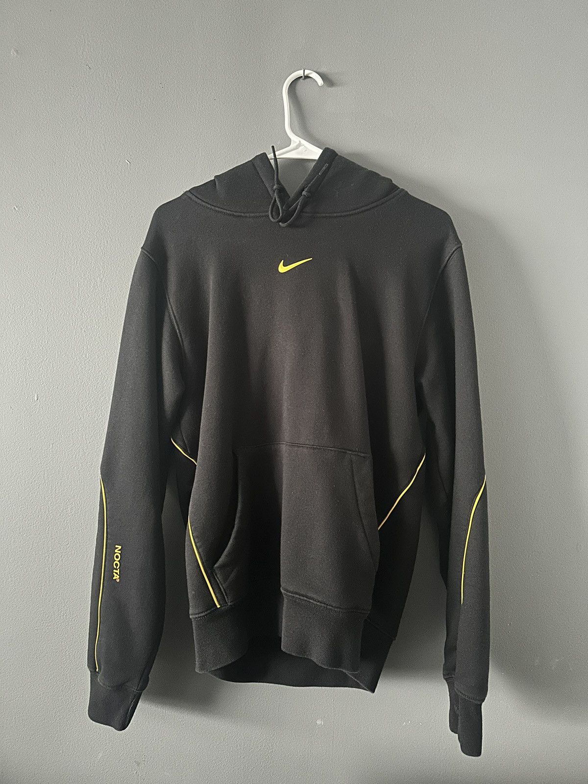 image of Drake Nocta Hooded Sweatshirt in Black/Yellow, Men's (Size XS)