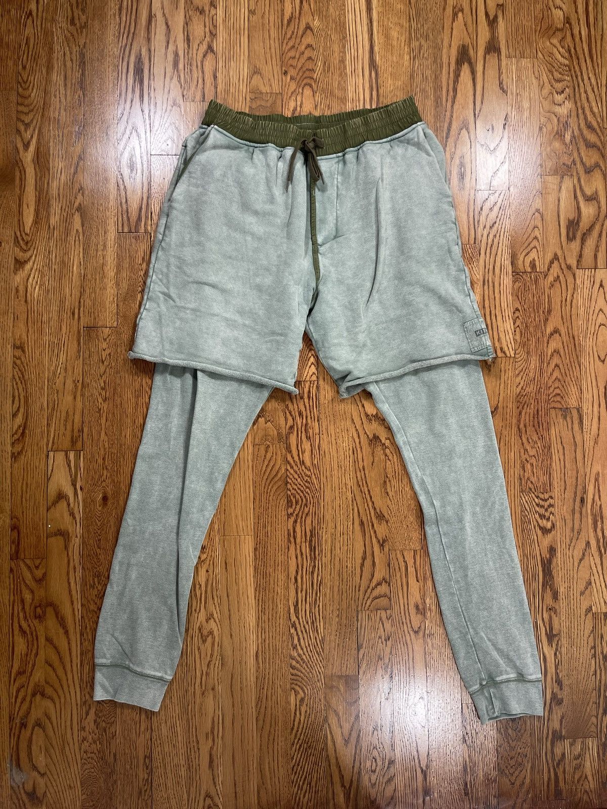 image of Kith Ronnie Fieg Double Layered Sweatpants Sweat Shorts in Olive, Men's (Size 32)