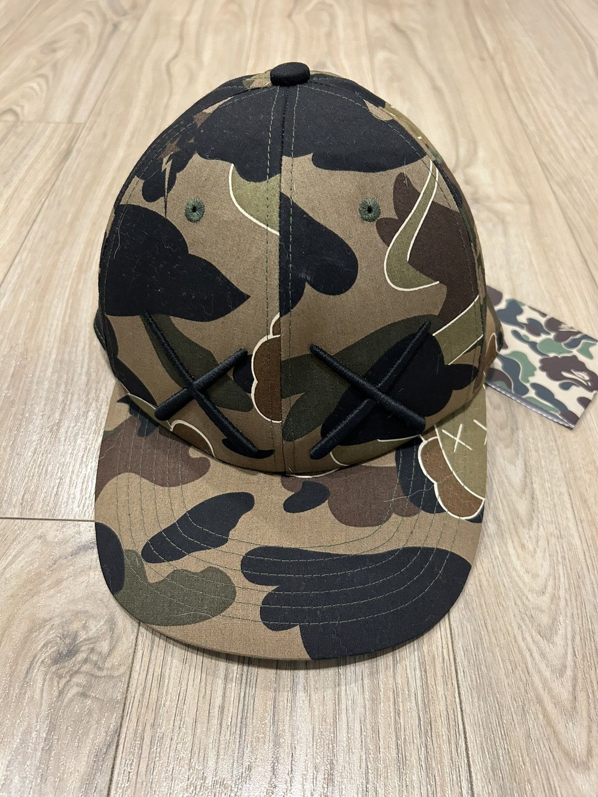 image of Bape x Kaws Og 2005 A Bathing Ape X Kaws Green Camo Cap, Men's