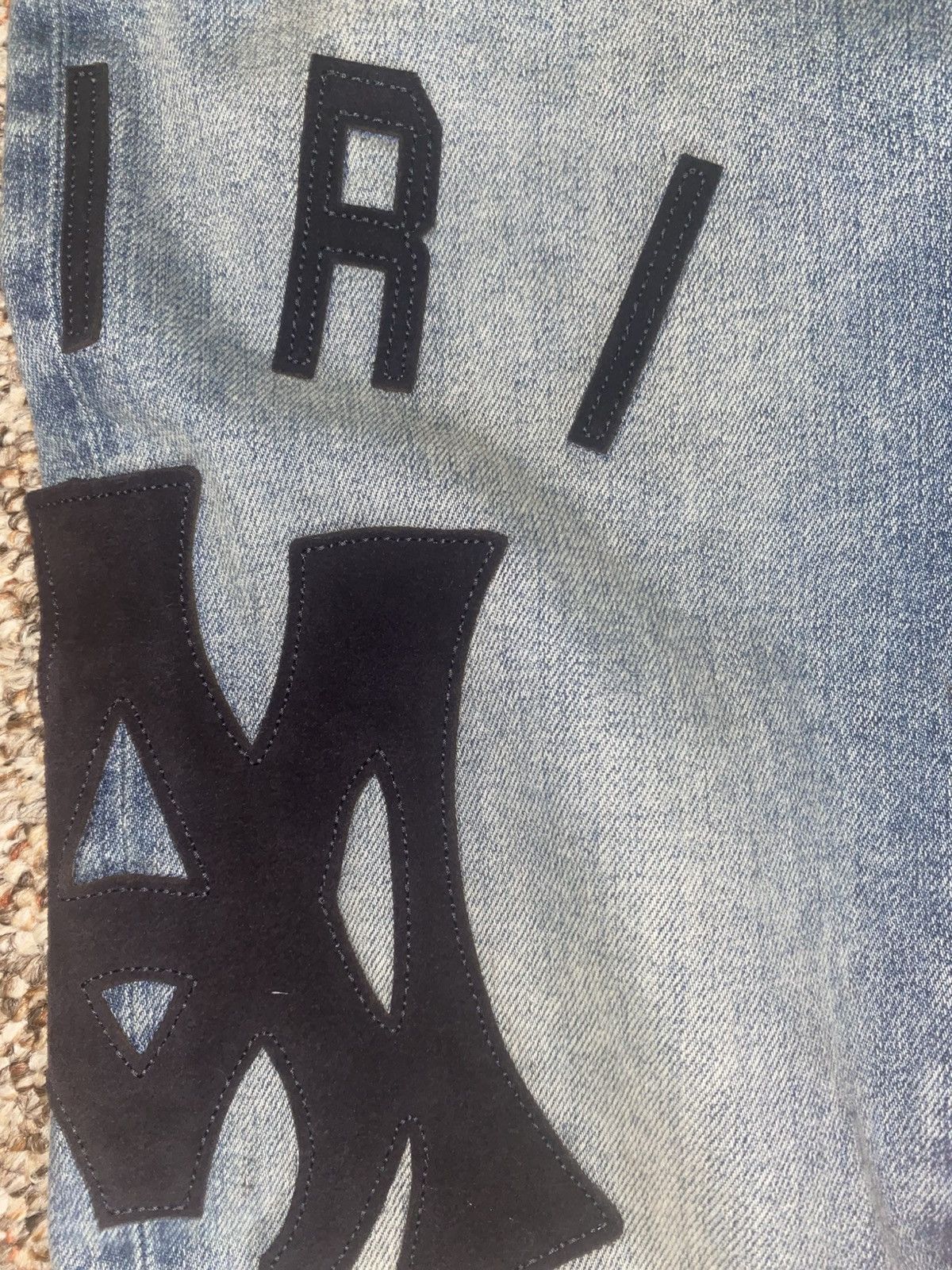 Amiri suede appliqué logo jeans