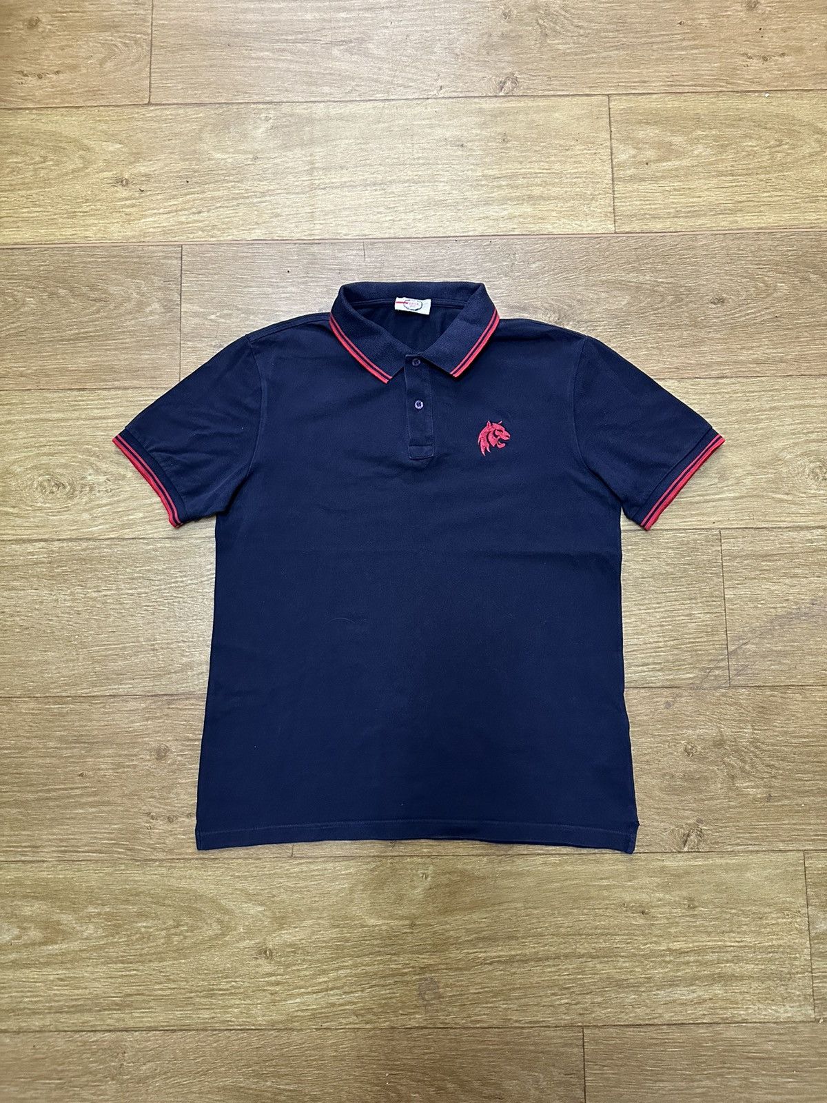 Prada PRADA LION LOGO POLO SHIRT | Grailed