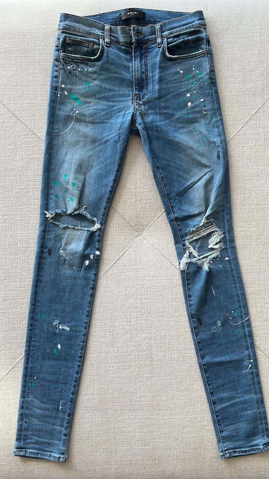 AMIRI paint splatter distressed skinny jean