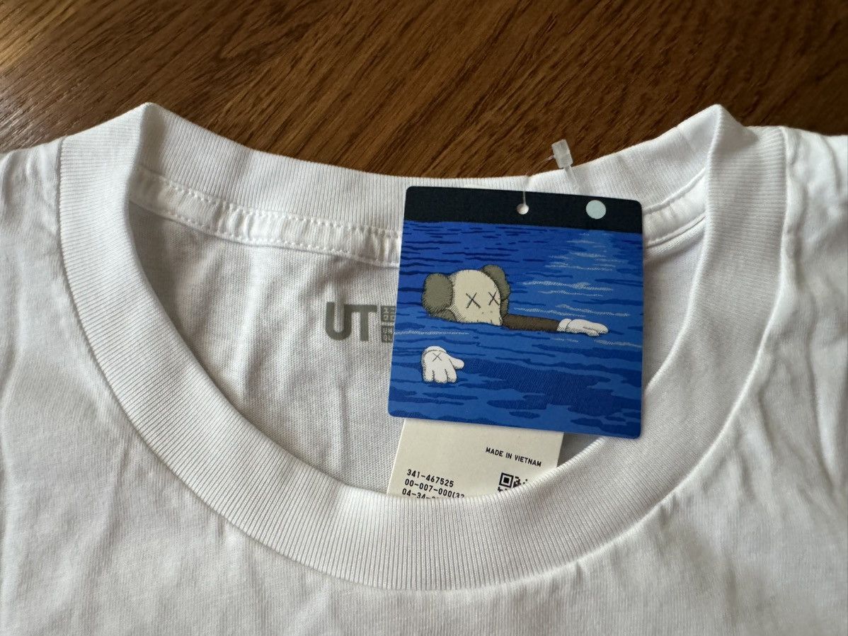 Kaws × Uniqlo Medium Kaws Artbook Cover Tee White Uniqlo UT T-Shirt Figure Size US M / EU 48-50 / 2 - 4 Thumbnail
