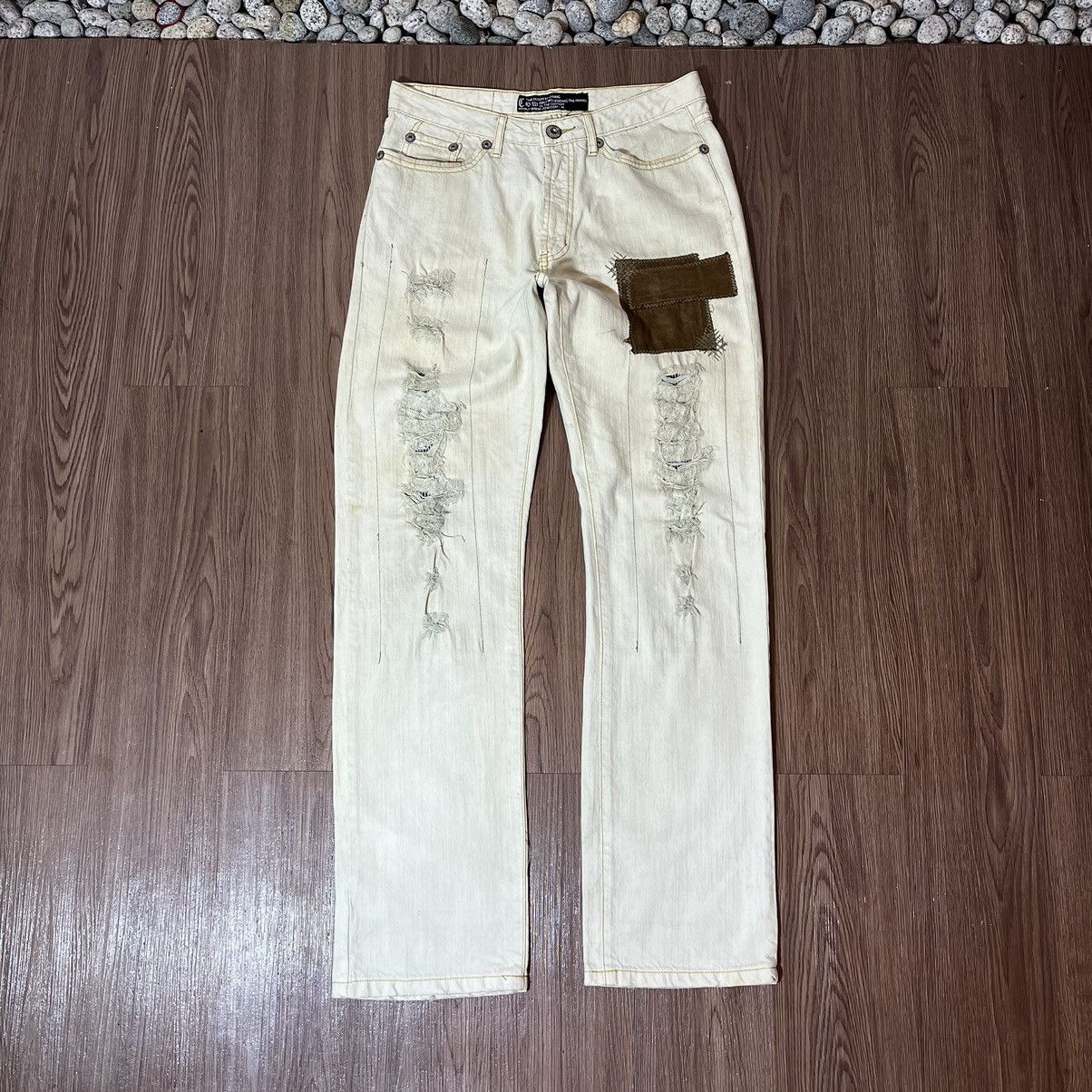 Qing Wu Distressed Patchwork Jeans by Chang