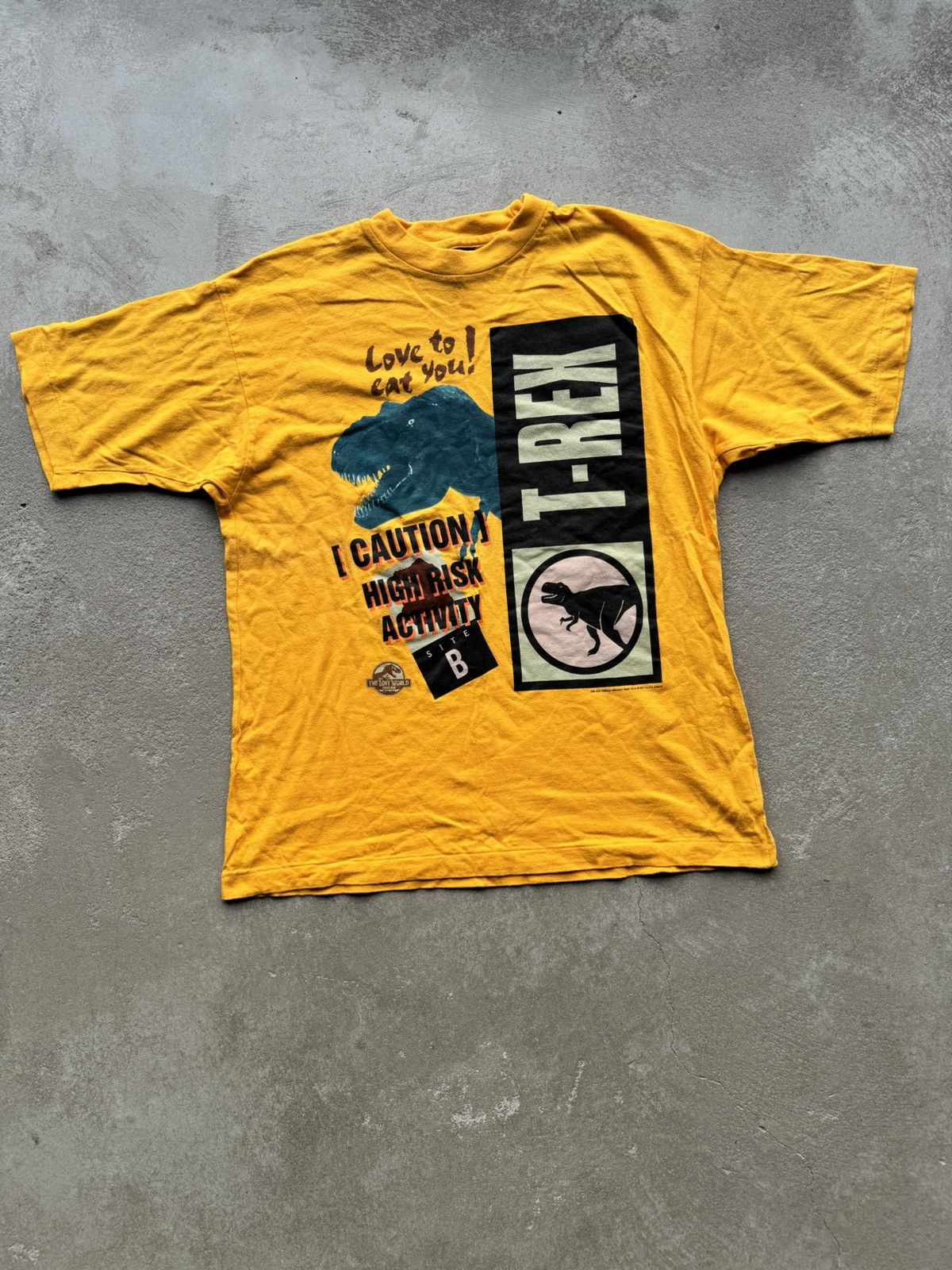 image of Made In USA x Movie Jurassic Park 1997 The Lost World T-Rex T Shirt Travis Vibe in Yellow (Size Med