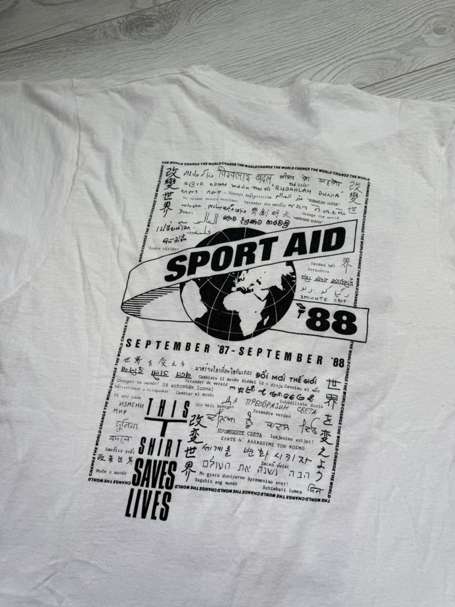 Signal Sport × Vintage 1988 SPORT AID STATUS QUO I CHANGED THE WORLD T-SHIRT (L) Size US XL / EU 56 / 4 - 2 Thumbnail