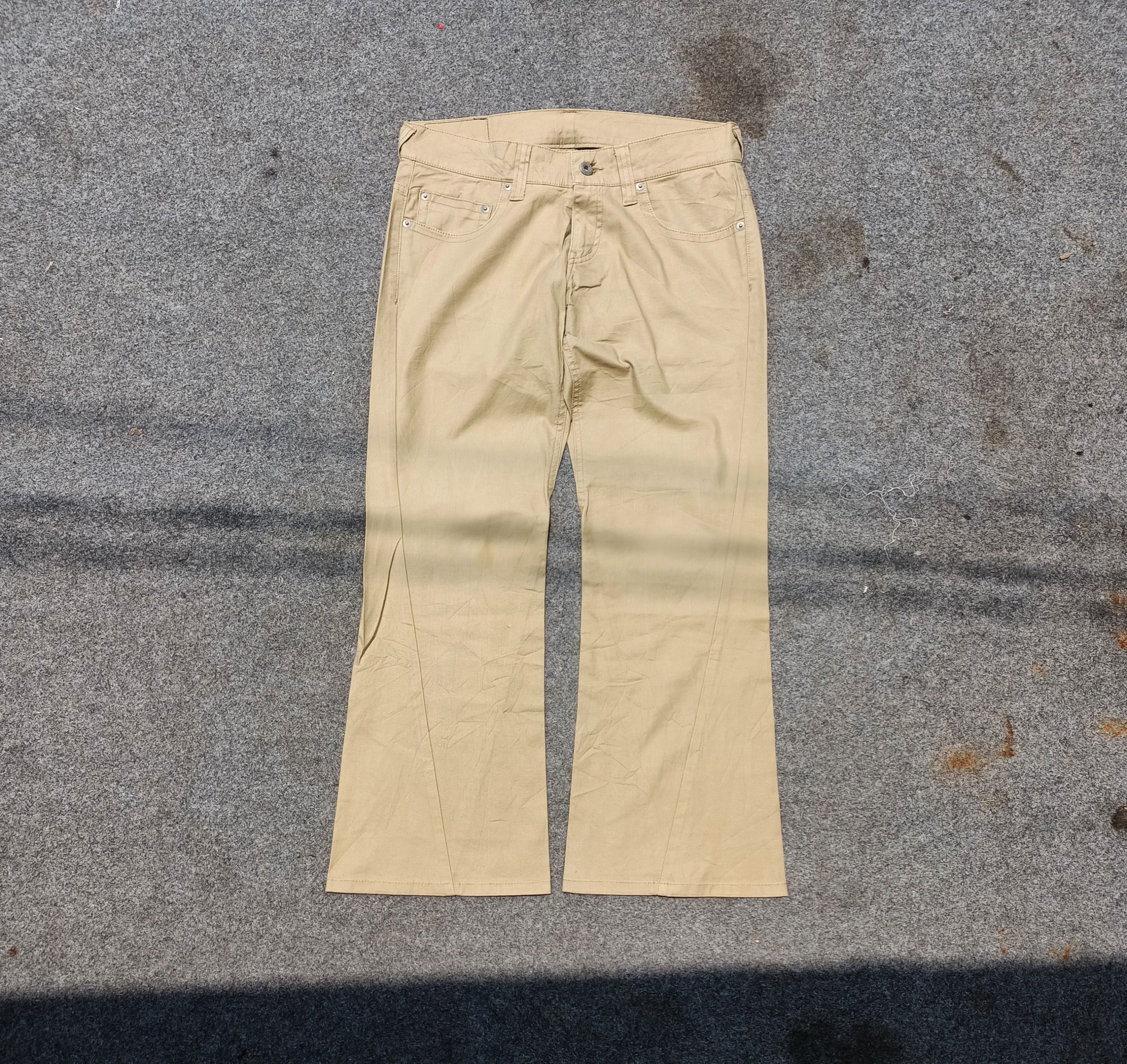 Tornado Mart Tornado Mart asymmetrical stitching flared pants | Grailed