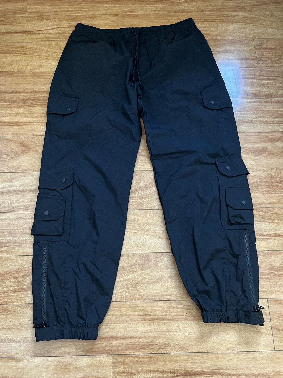 image of John Elliott John Elliot Paneled Nylon Cargo Pants in Black, Men's (Size 38)