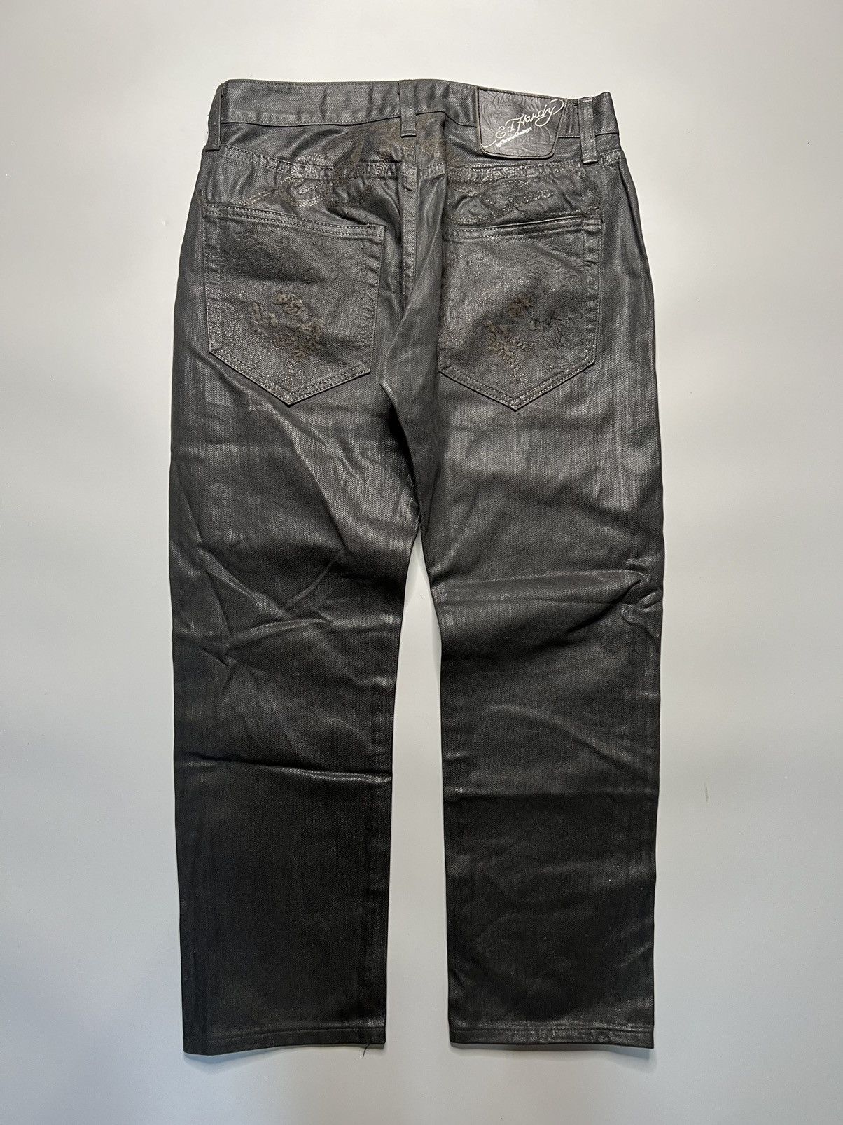 image of Christian Audigier x Ed Hardy Embroidered Skull And Script Logo Waxed Jeans in Black (Size 32)
