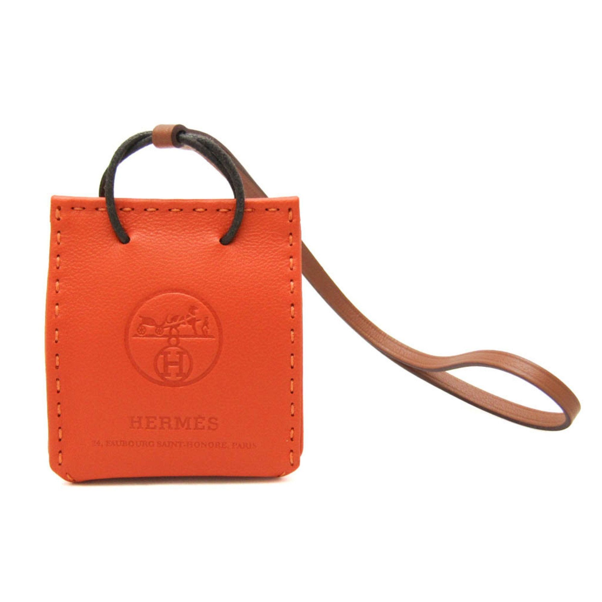 image of Hermes Agneau Milo Handbag Charm Brown,orange Sac Orange, Women's