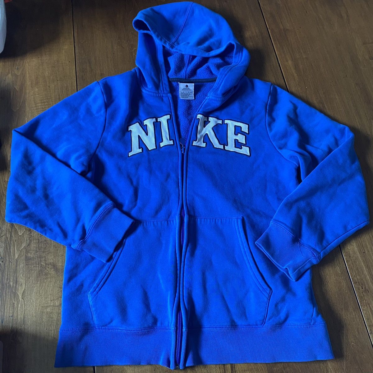 Nike blue zip up on sale