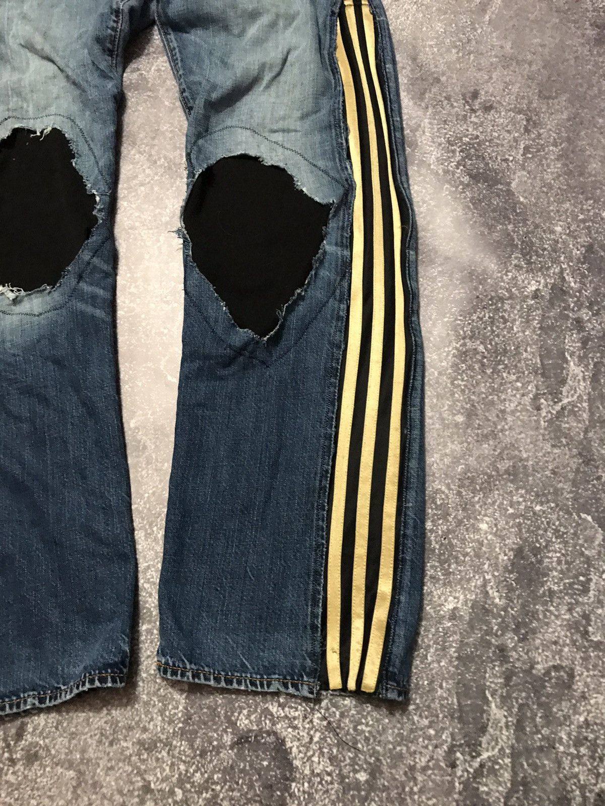 Adidas ripped jeans on sale