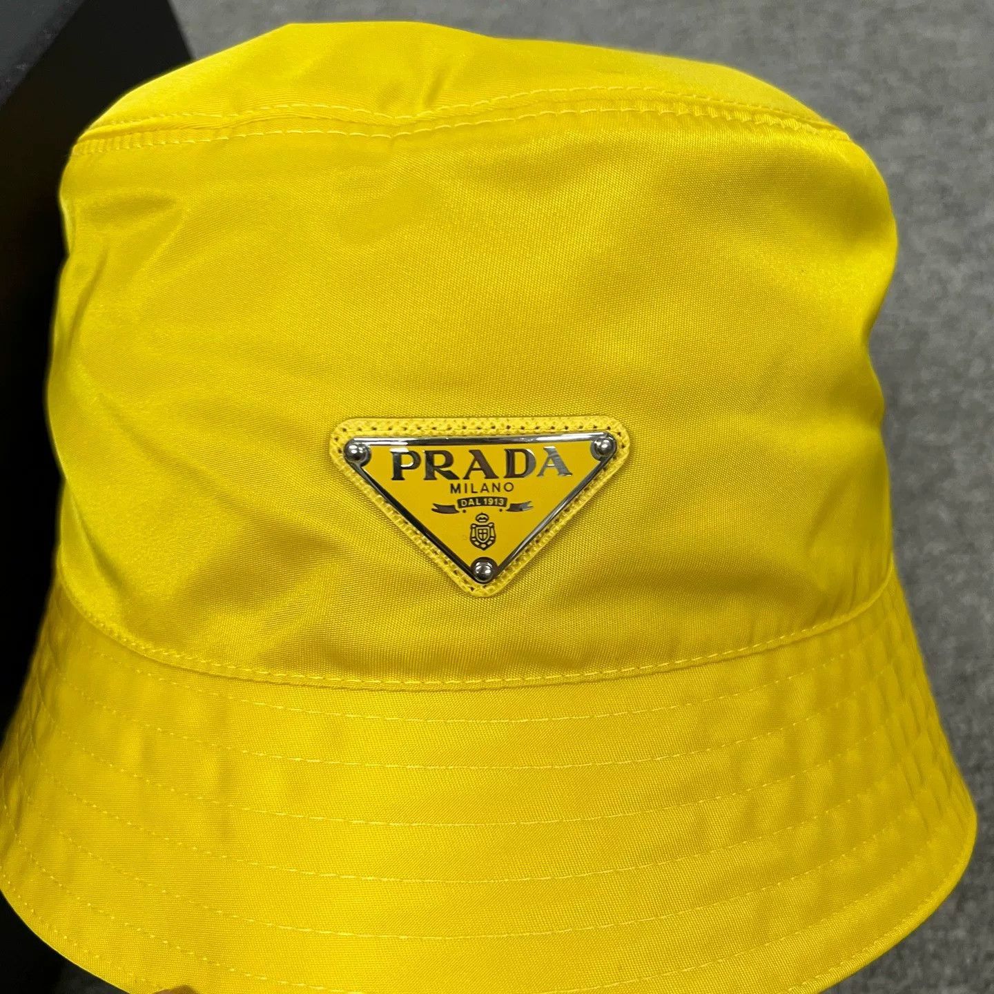 Prada Prada Triangle Logo Nylon Bucket Hat Yellow Size ONE SIZE - 1 Thumbnail