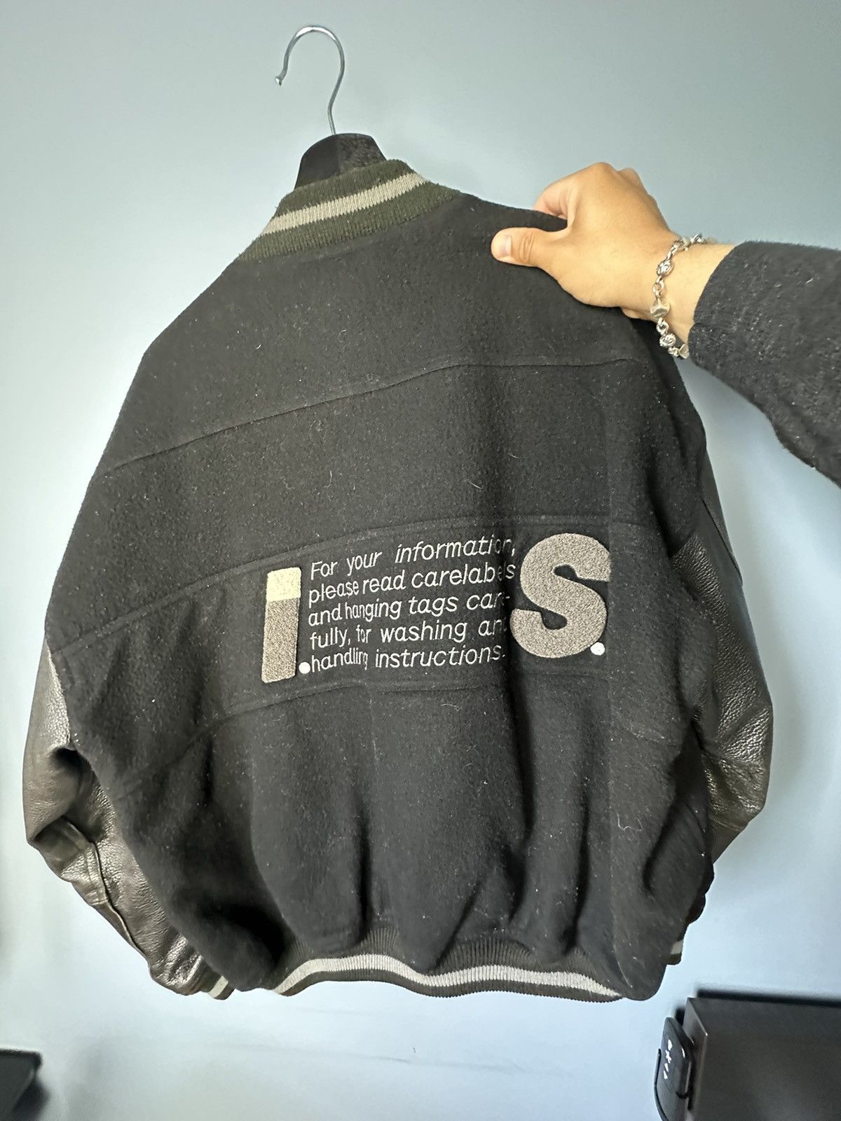 image of Homme Plisse Issey Miyake x Issey Miyake Care Label Bomber Jacket in Black, Men's (Size Medium)