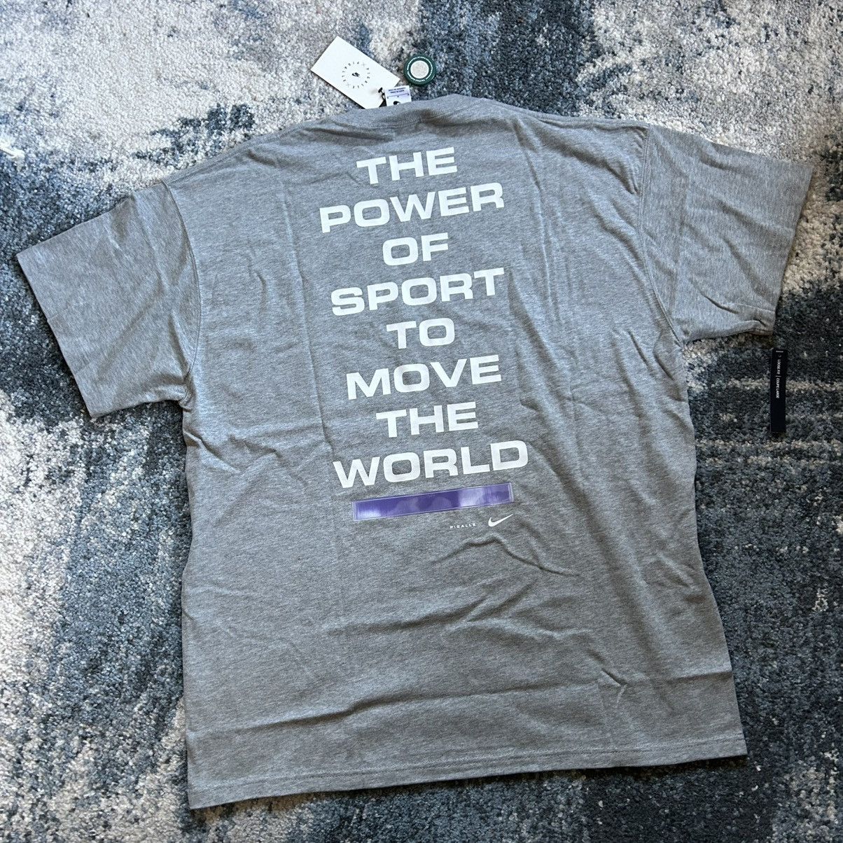 Nike × Pigalle 2019 THE POWER OF SPORT TO MOVE THE WORLD TEE HEATHER SAiL Size US M / EU 48-50 / 2 - 3 Thumbnail