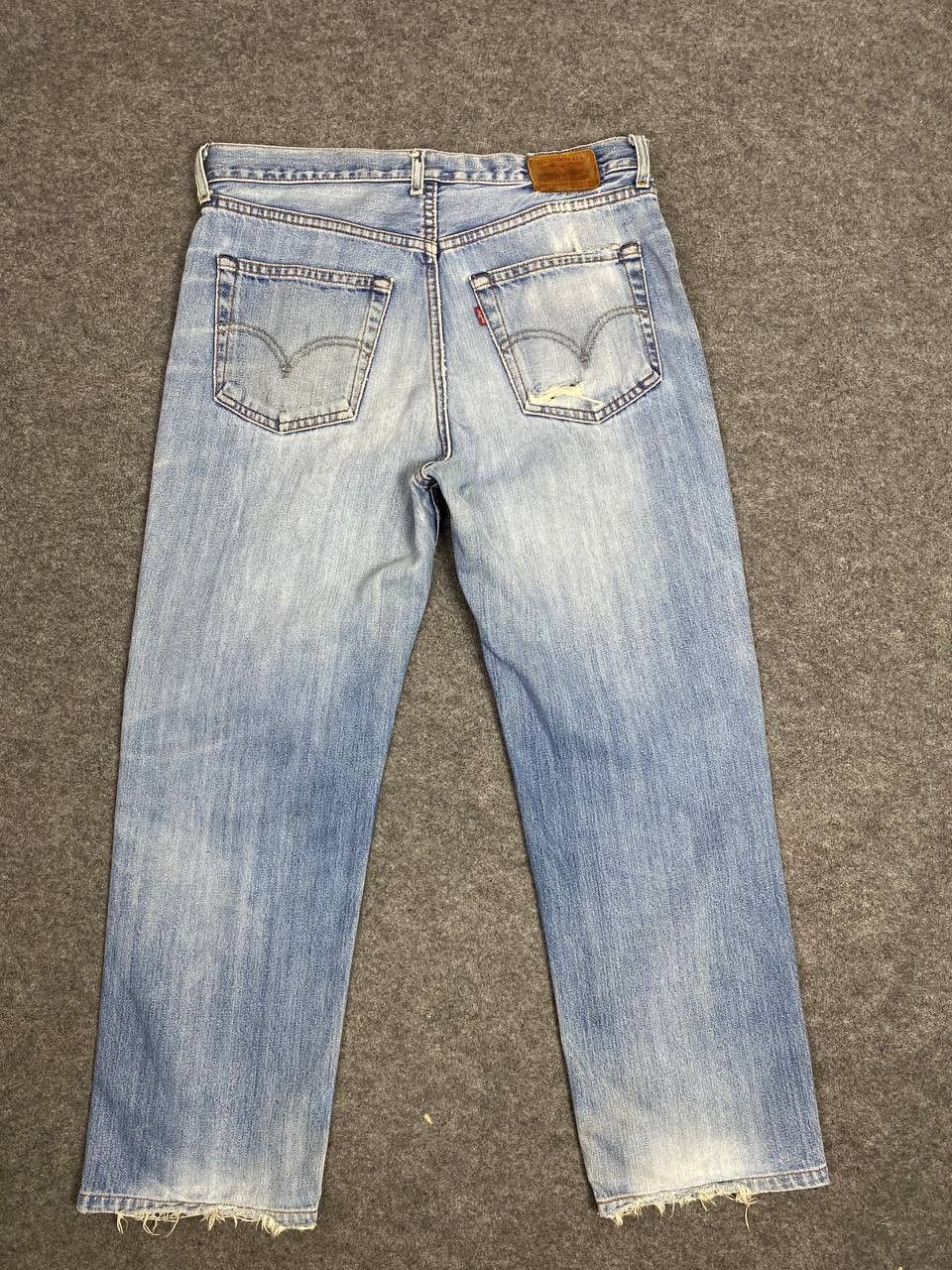 image of Vintage Levis 502 Lightwash Distressed Denim in Light Blue, Men's (Size 34)