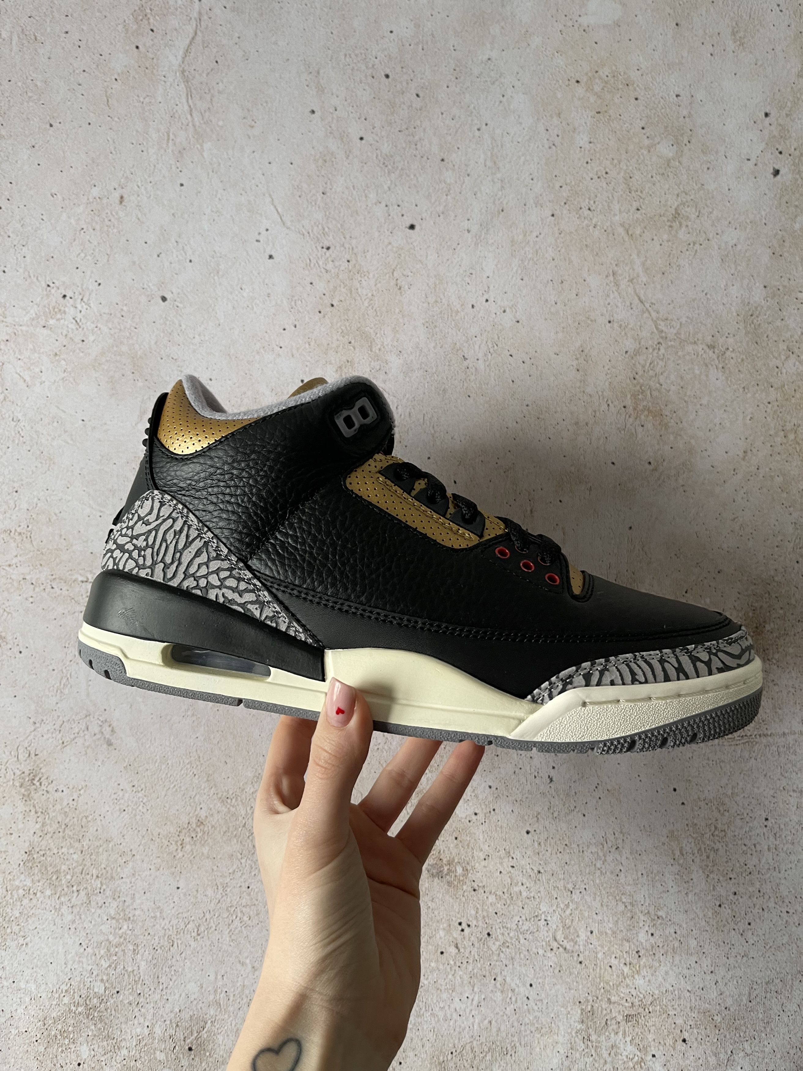 image of Jordan Brand 3 Retro Black Cement Gold (Women's) Shoes in Black/Fire Red/Metallic Gold (Size 9)