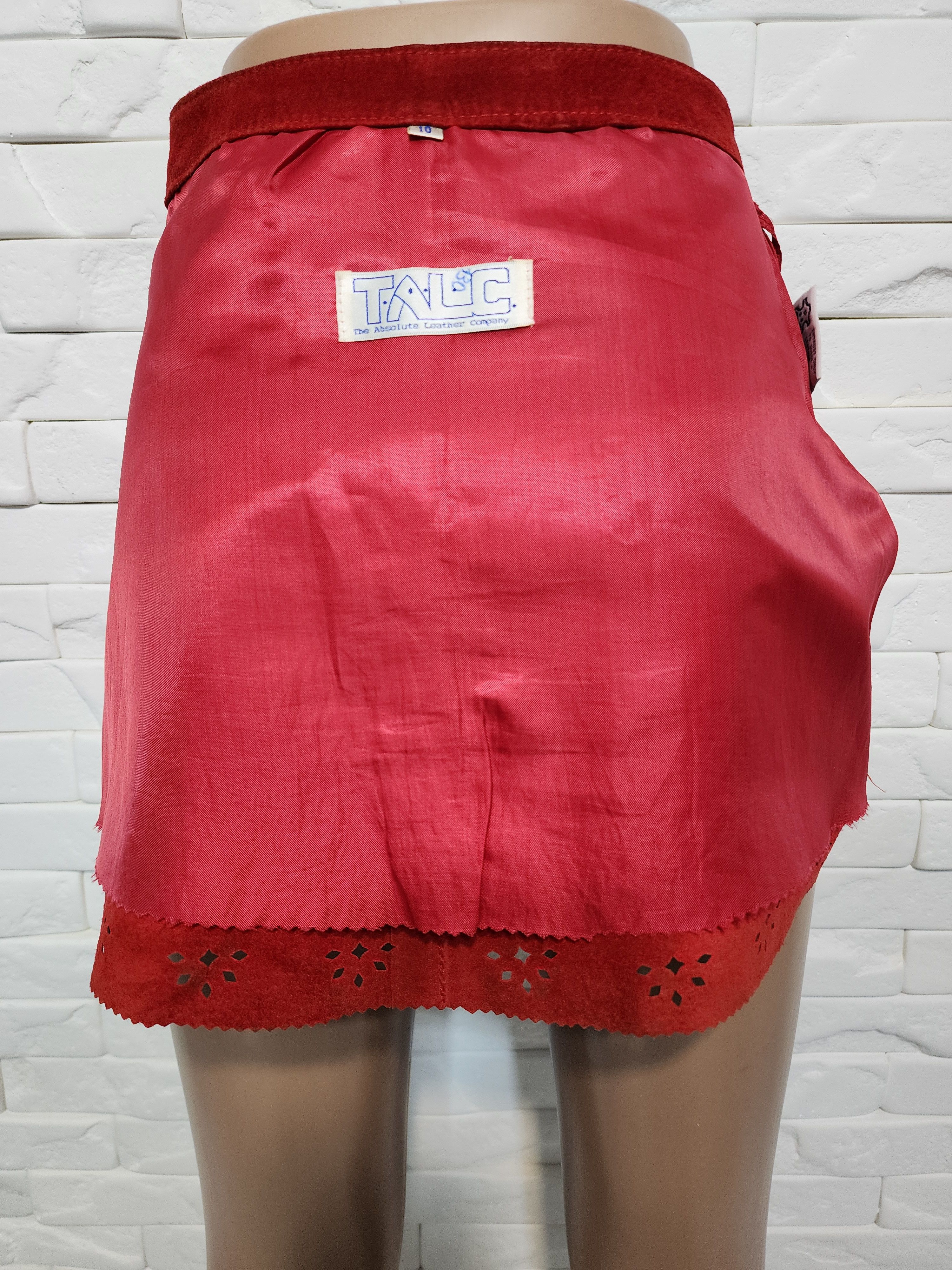 Red skirt made of genuine suede with perforation.