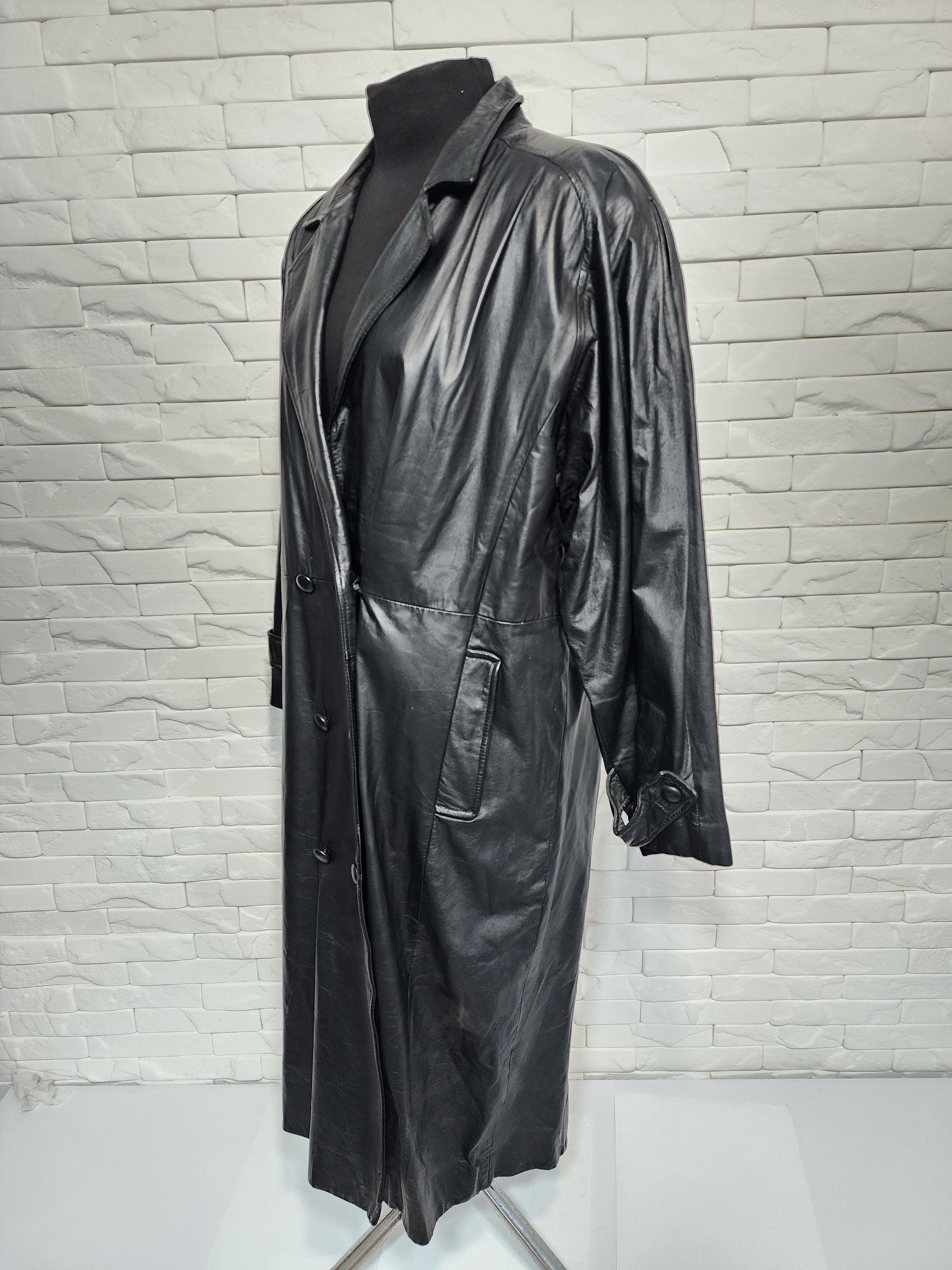 Women black leather raincoat.