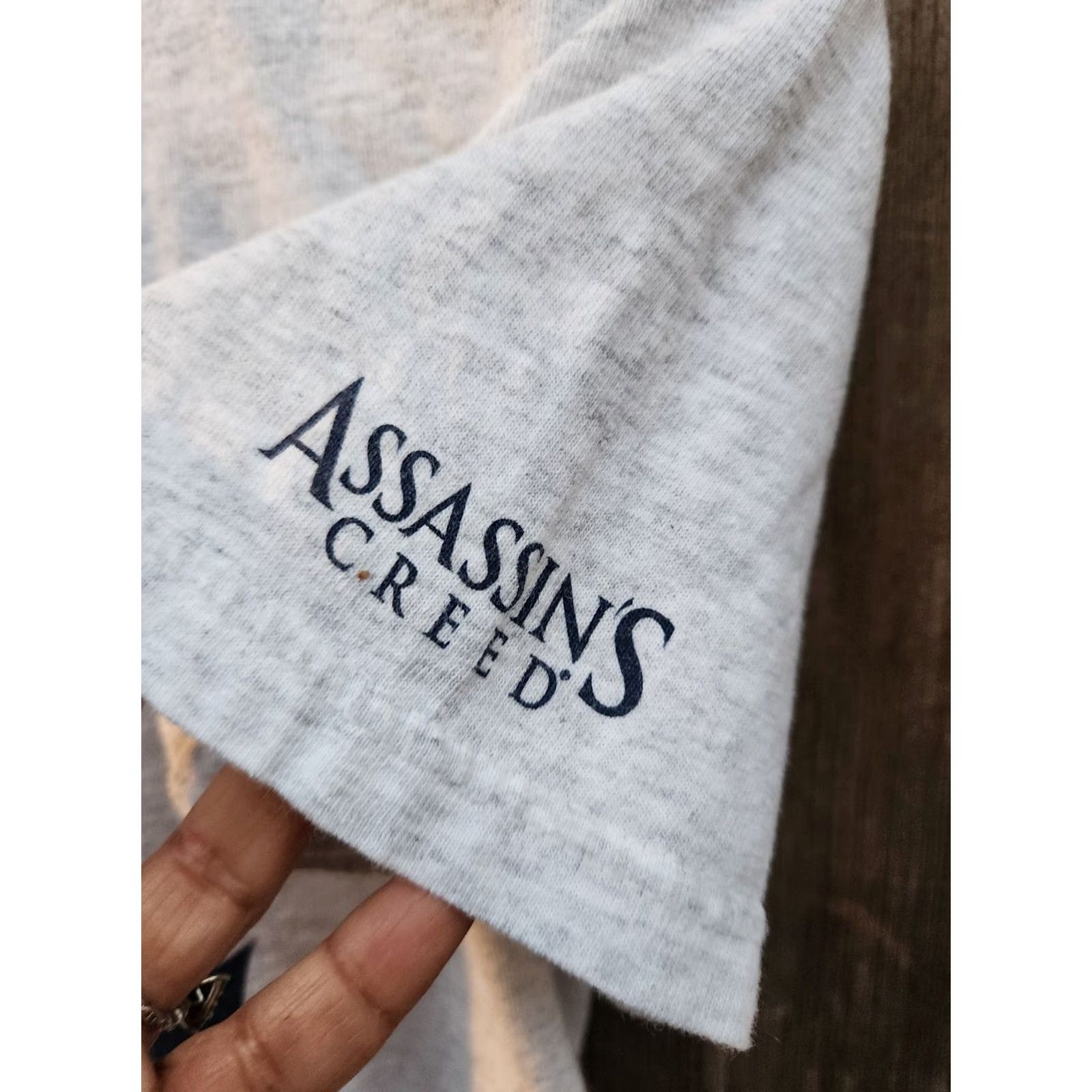 Vintage Ubisoft Assassin's Creed III 2012 Gray Graphic Video Game Promo Tshirt Size S Mens T-Shirt Logo Crew Neck Short Sleeve Cotton Regular Fit Size US S / EU 44-46 / 1 - 4 Thumbnail