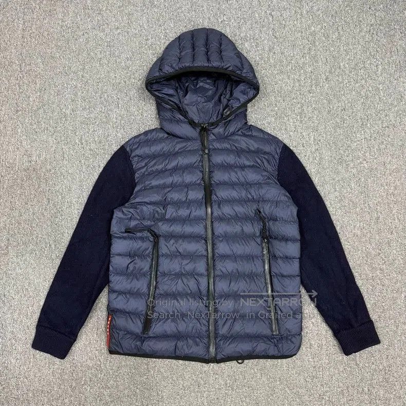 Prada Logo Knit Panel Down Jacket.