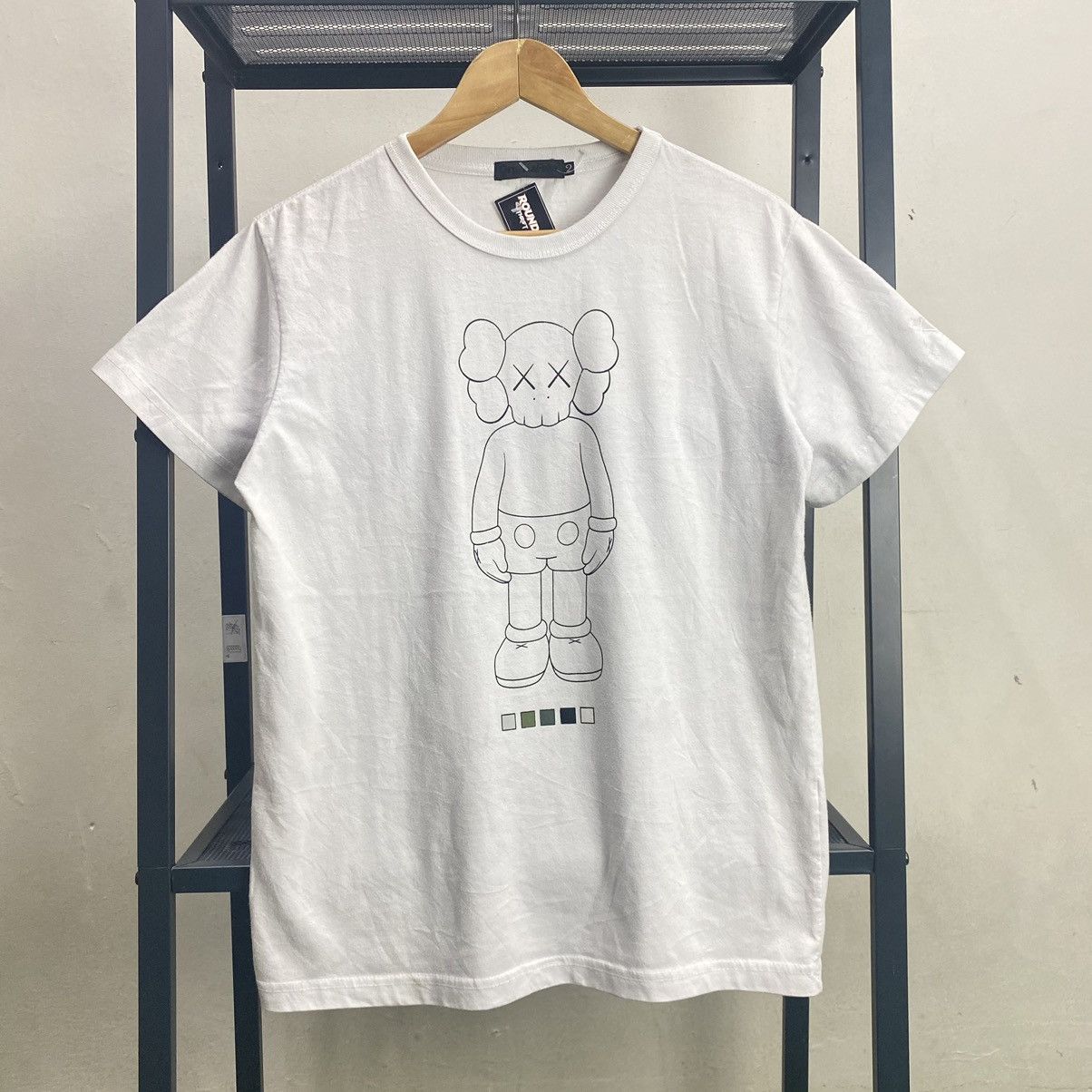 Original fake x kaws tee