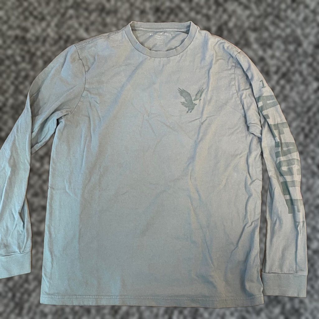 American Eagle Outfitters VINTAGE has no; ignore. Provide title: "American Eagle T-Shirt Long Sleeve Mens LT Green Crew Neck Logo Graphic Print All Seasons" Size US L / EU 52-54 / 3 - 1 Thumbnail