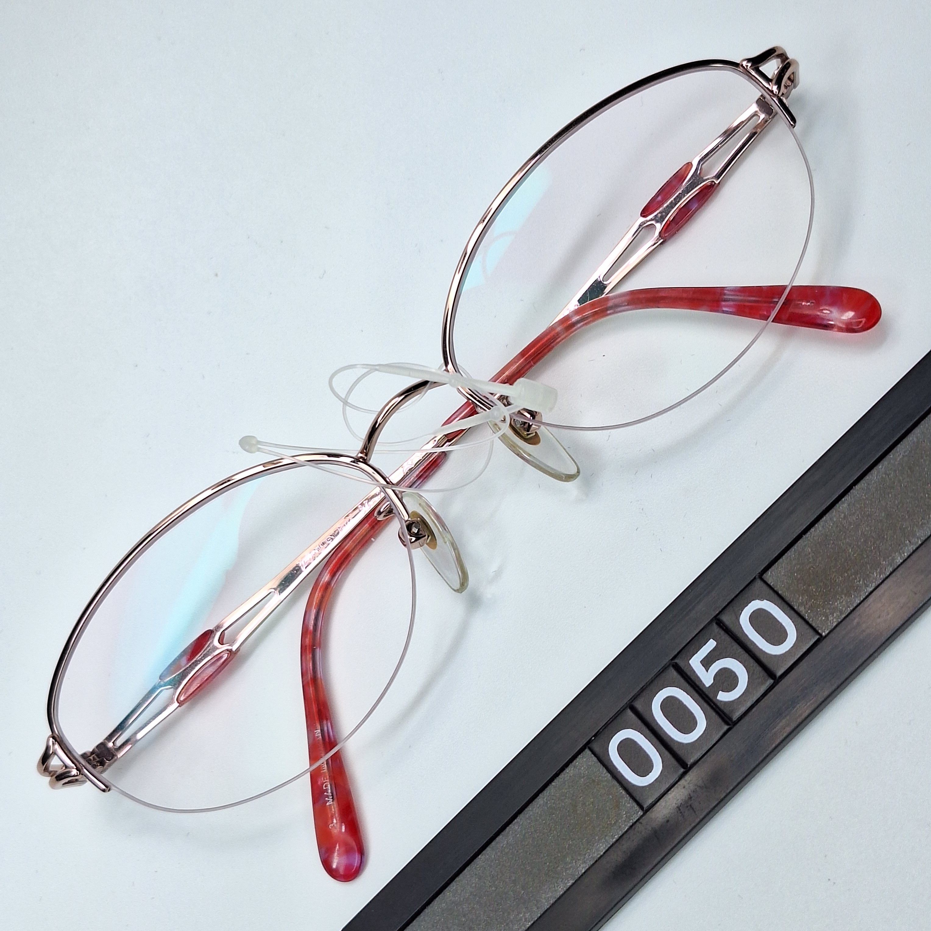 Yves Saint Laurent Yves Saint Laurent 30-0079 PureTitan Half-Rimless Eyeglasses Size ONE SIZE - 1 Thumbnail