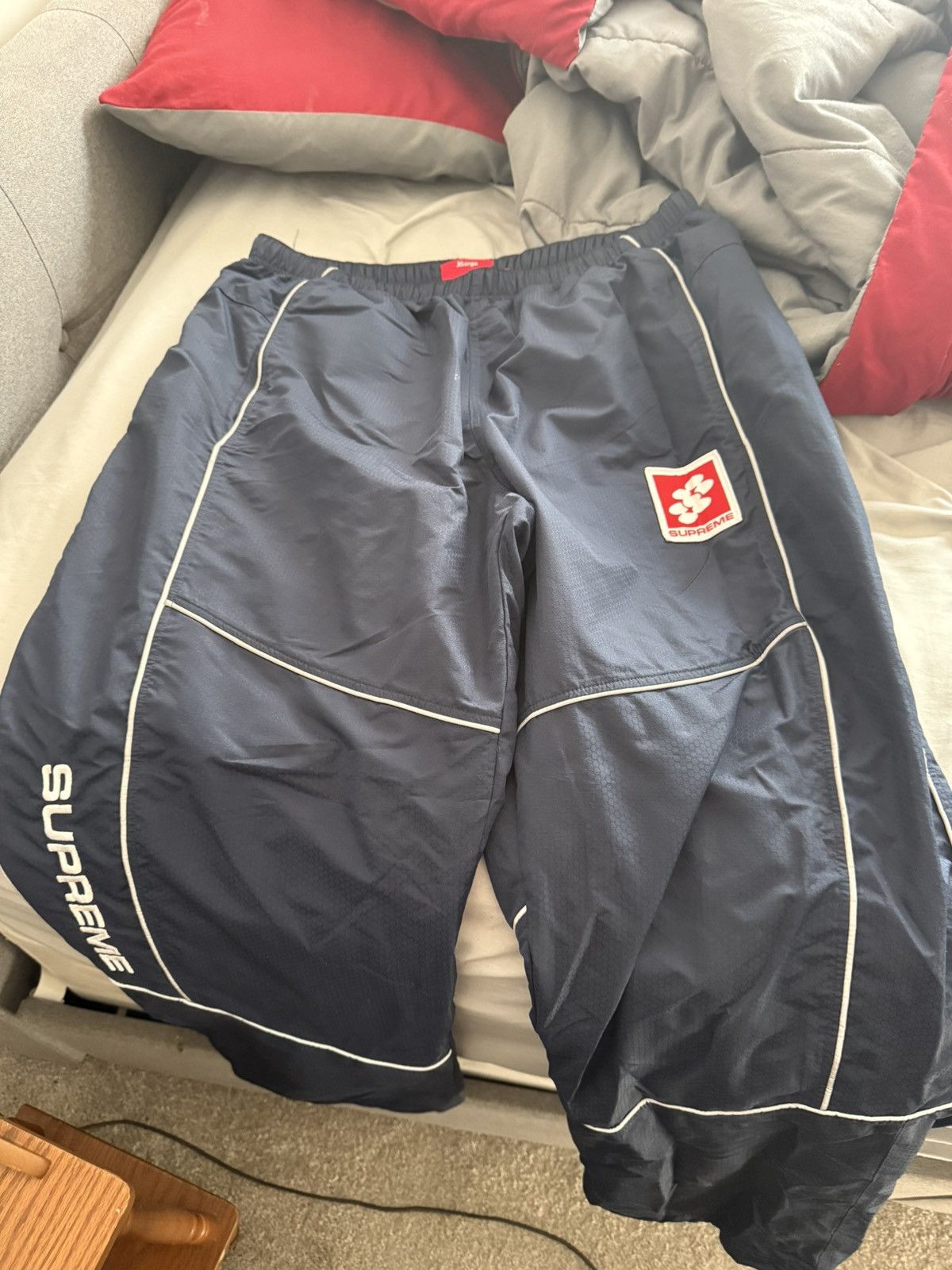 Hypebeast × Supreme SUPREME Reflective Piping Track Pants | Grailed