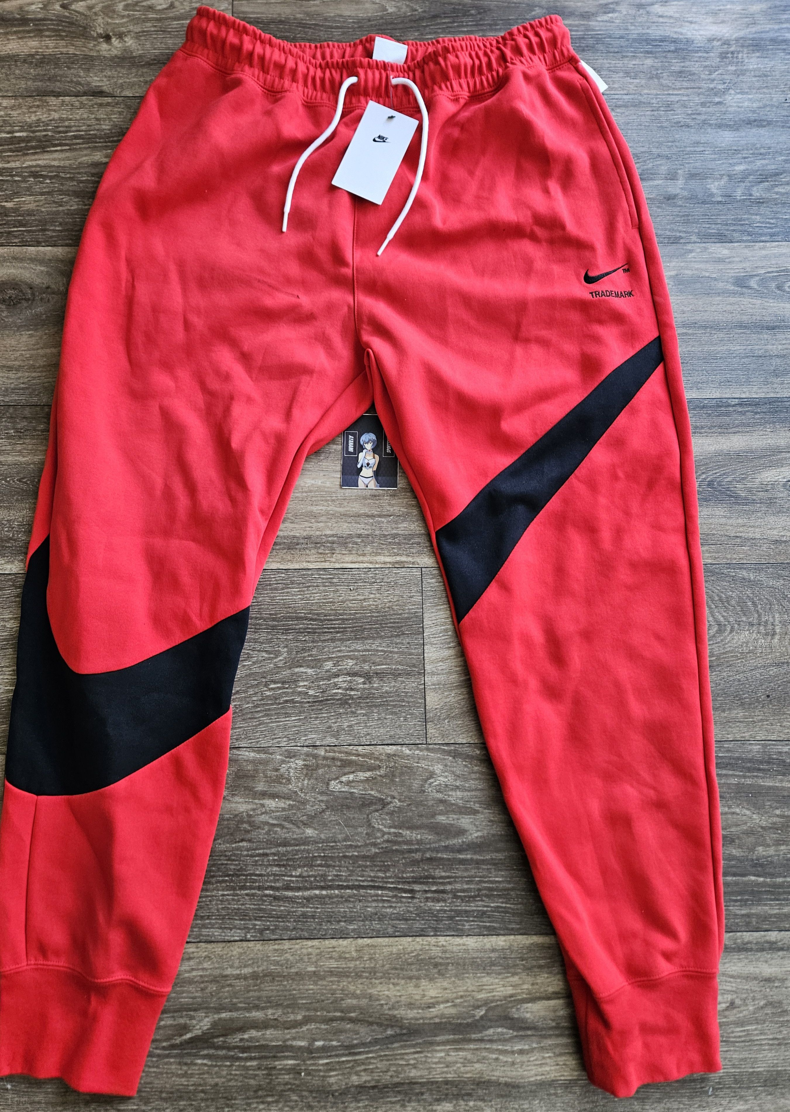 image of Nike Tech Fleece Swoosh Jogger Pants in Red, Men's (Size 34)