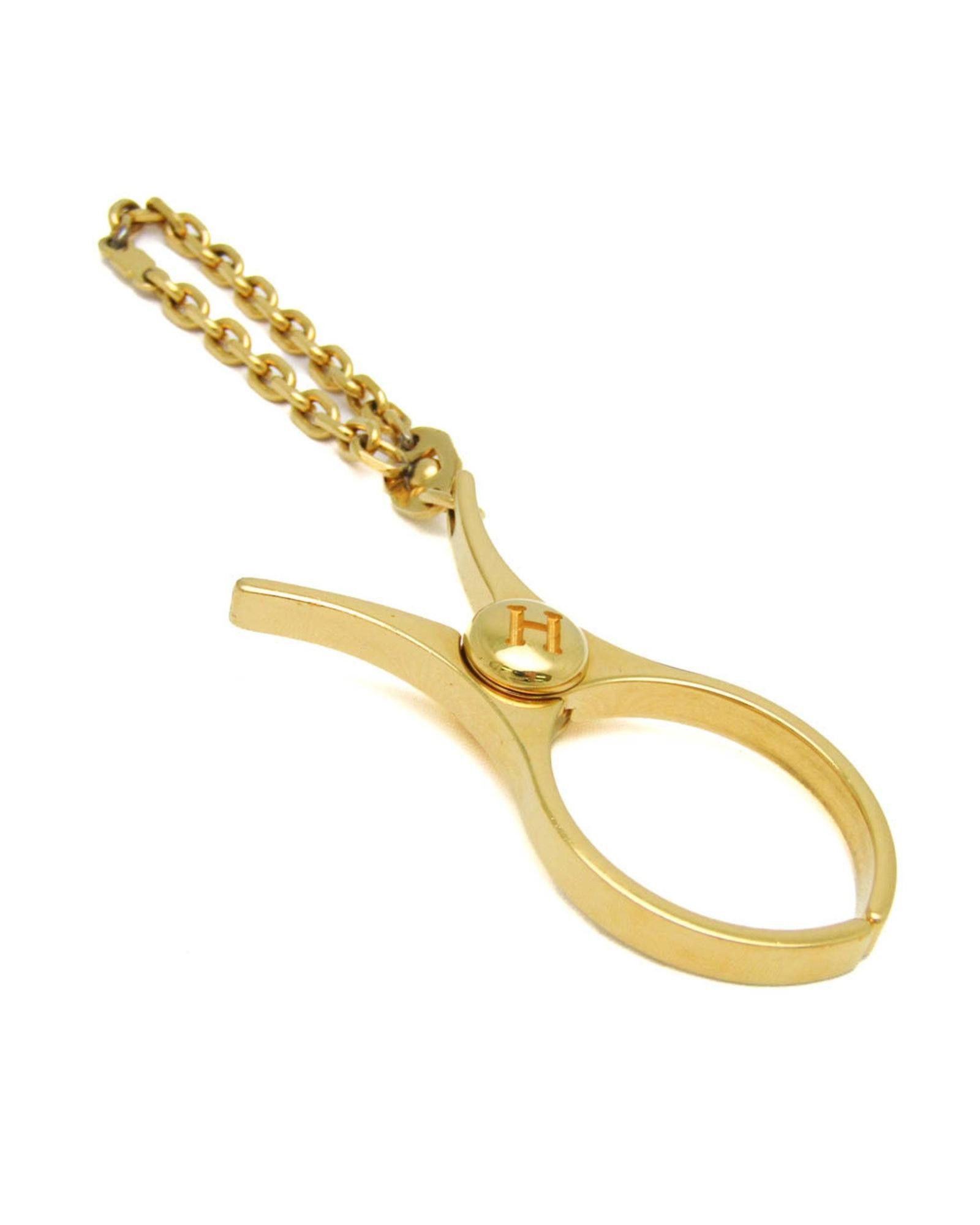 image of Sophisticated Gold Metal Glove Holder By Hermes, Women's