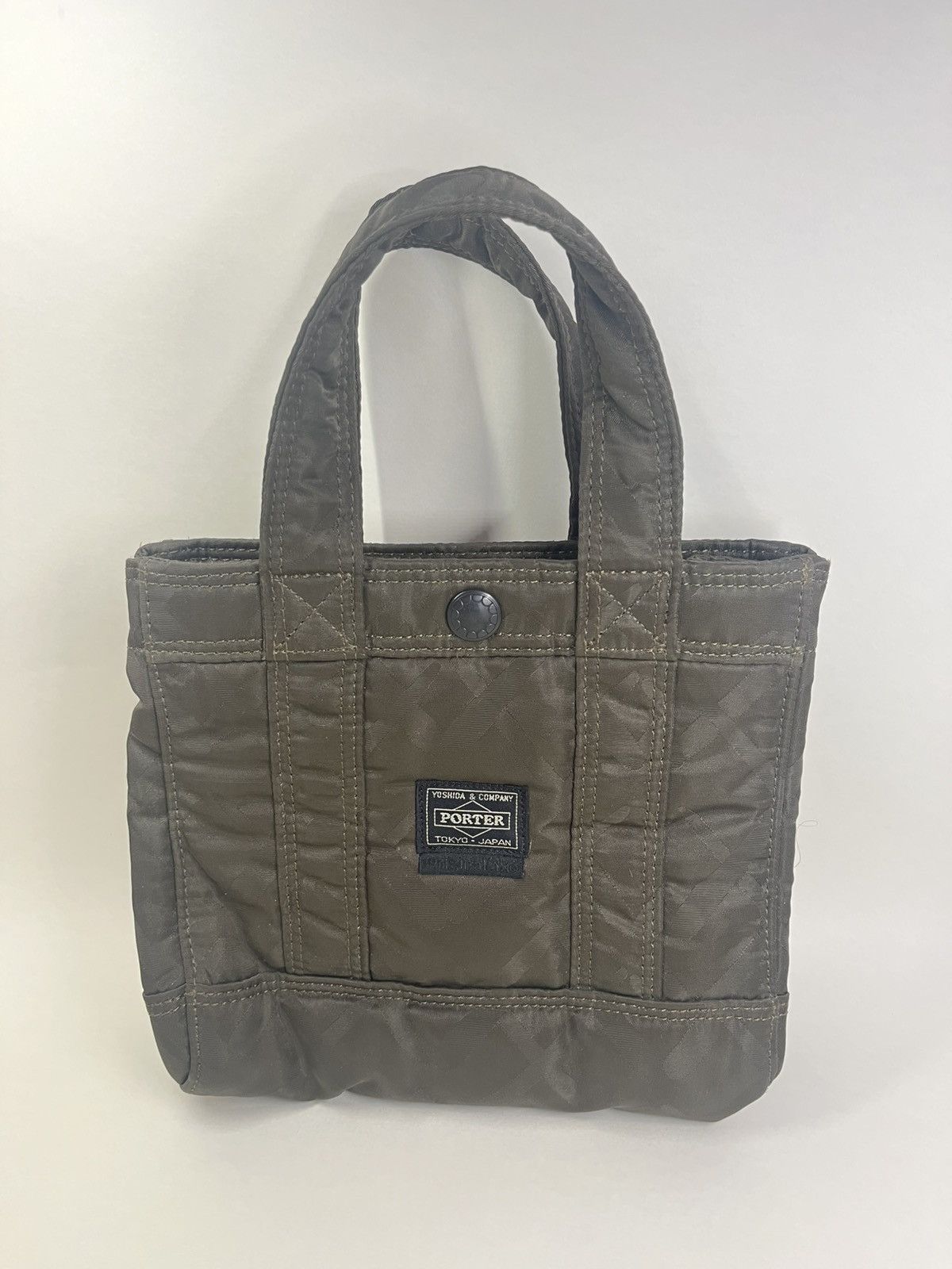 Original Fake KAWS x OriginaFake x Porter Yoshida mini tote | Grailed