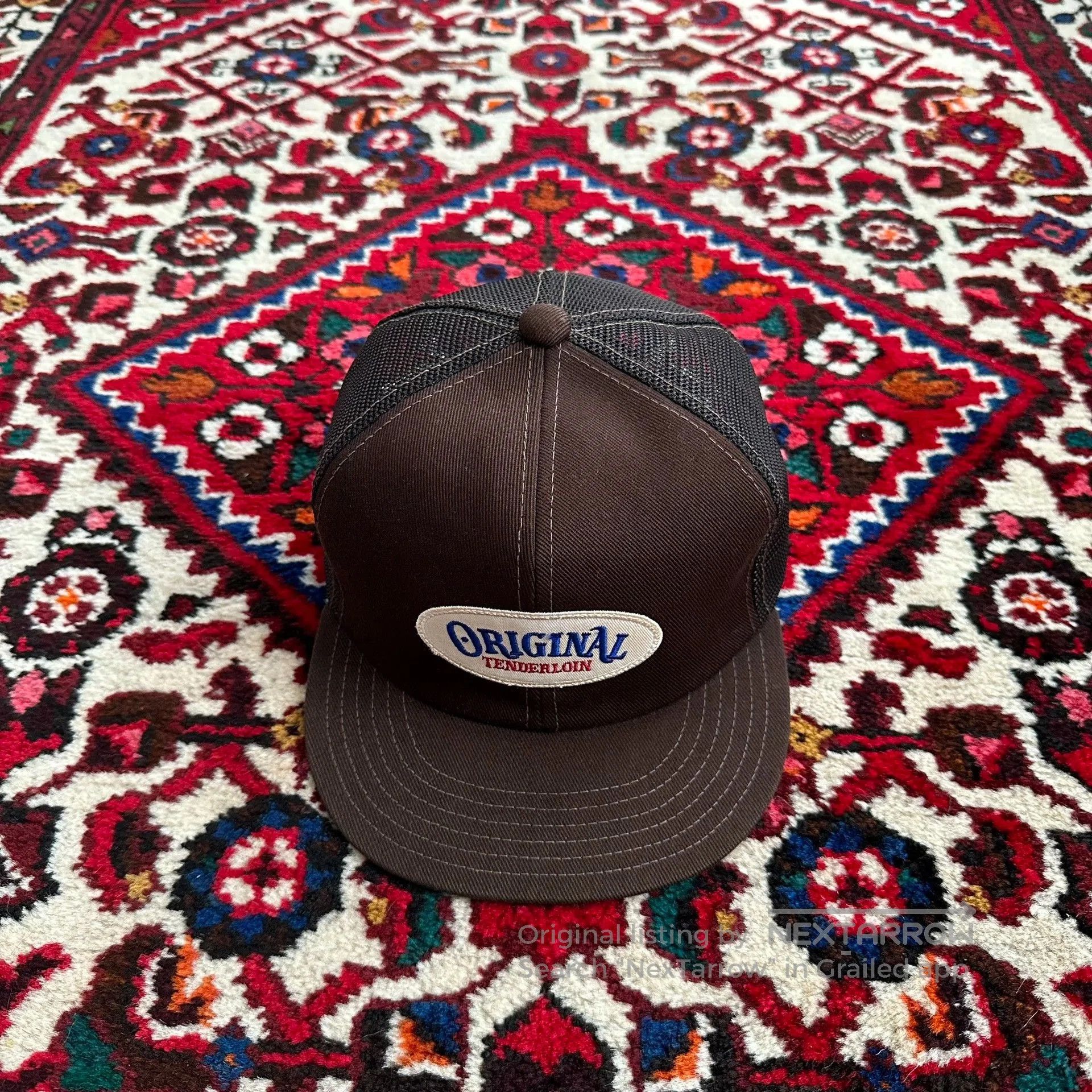 tenderloin trucker cap with oval logo.