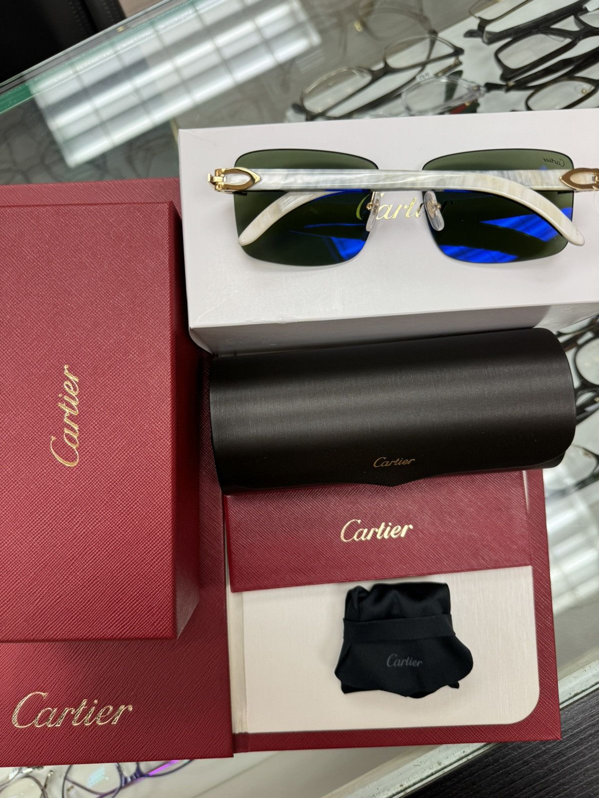 Cartier glasses white online buffs