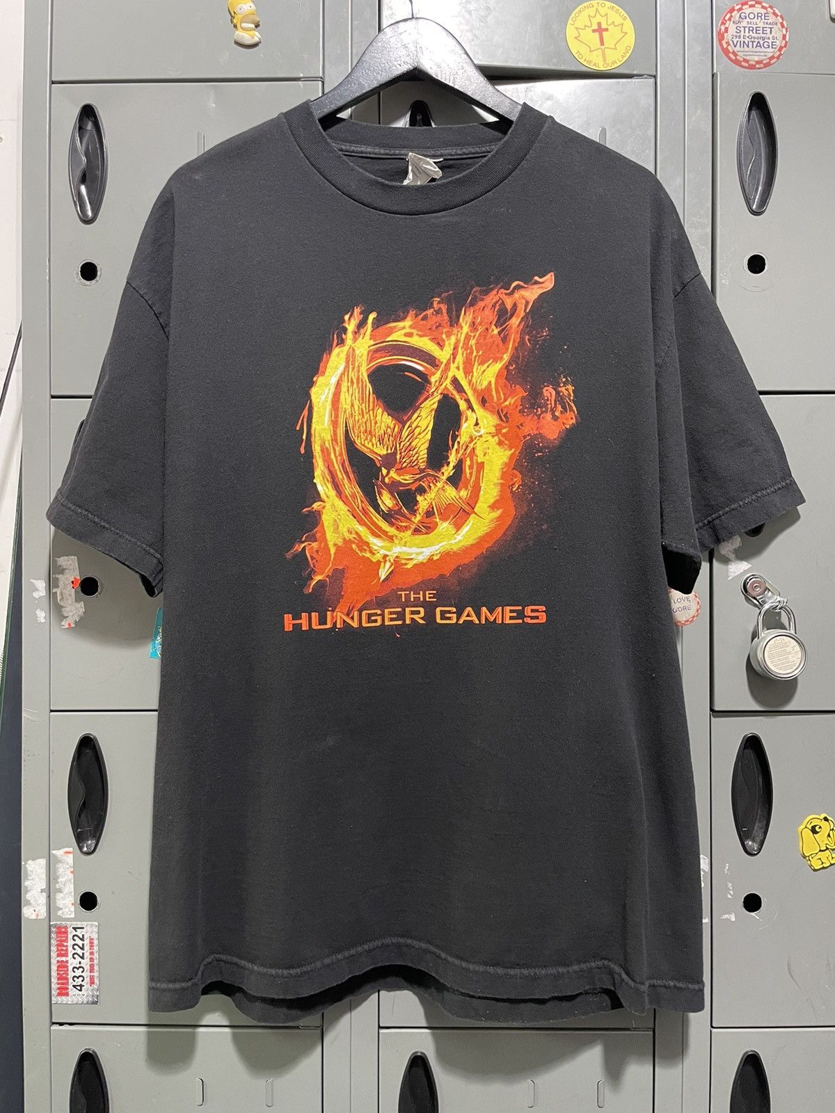 image of Aaa x Movie 2012 The Hunger Games Movie Theatre Promo in Black, Men's (Size XL)