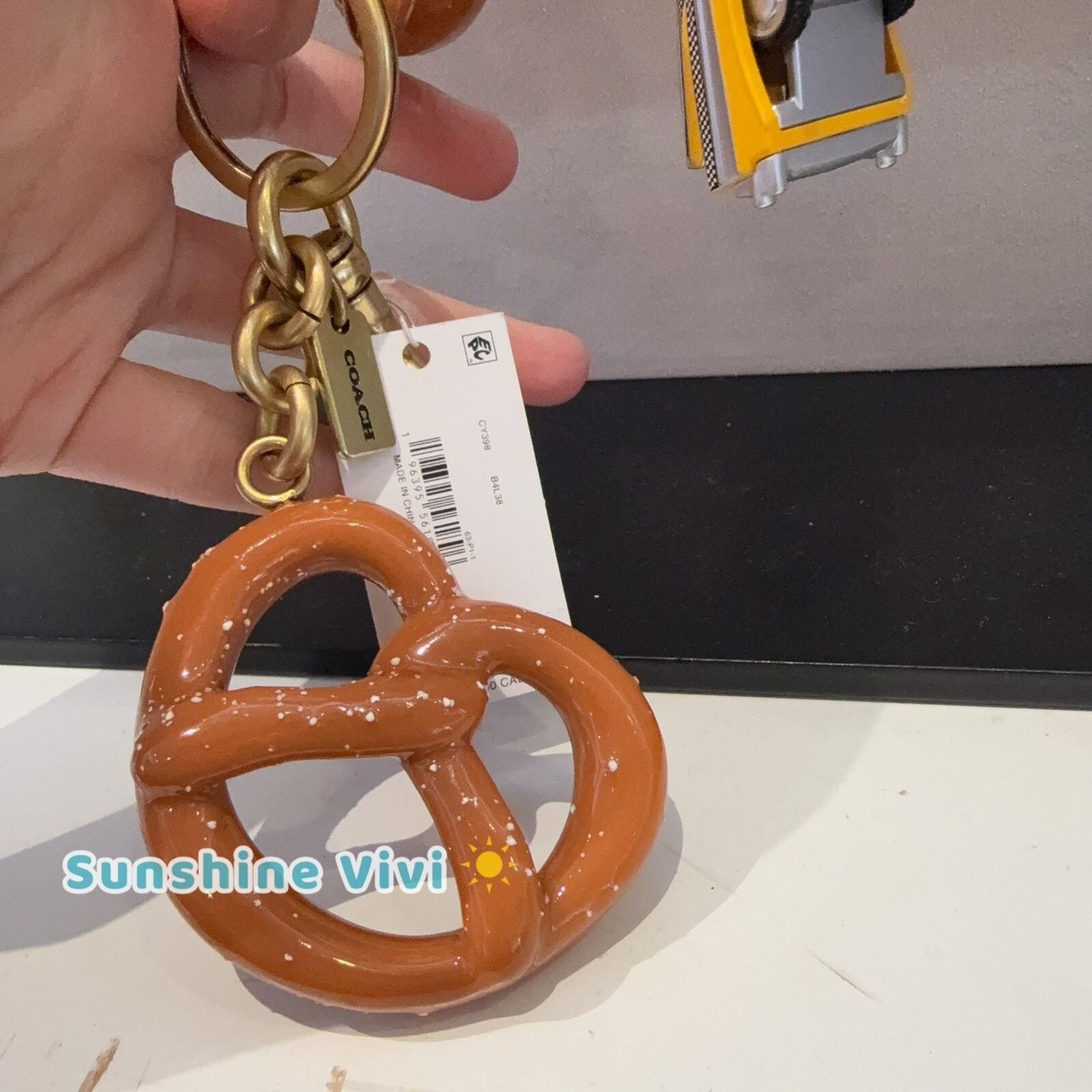 Coach NWT Coach Small Pretzel Bag Charm Keychain Brass Brown CY398 Size ONE SIZE - 4 Thumbnail