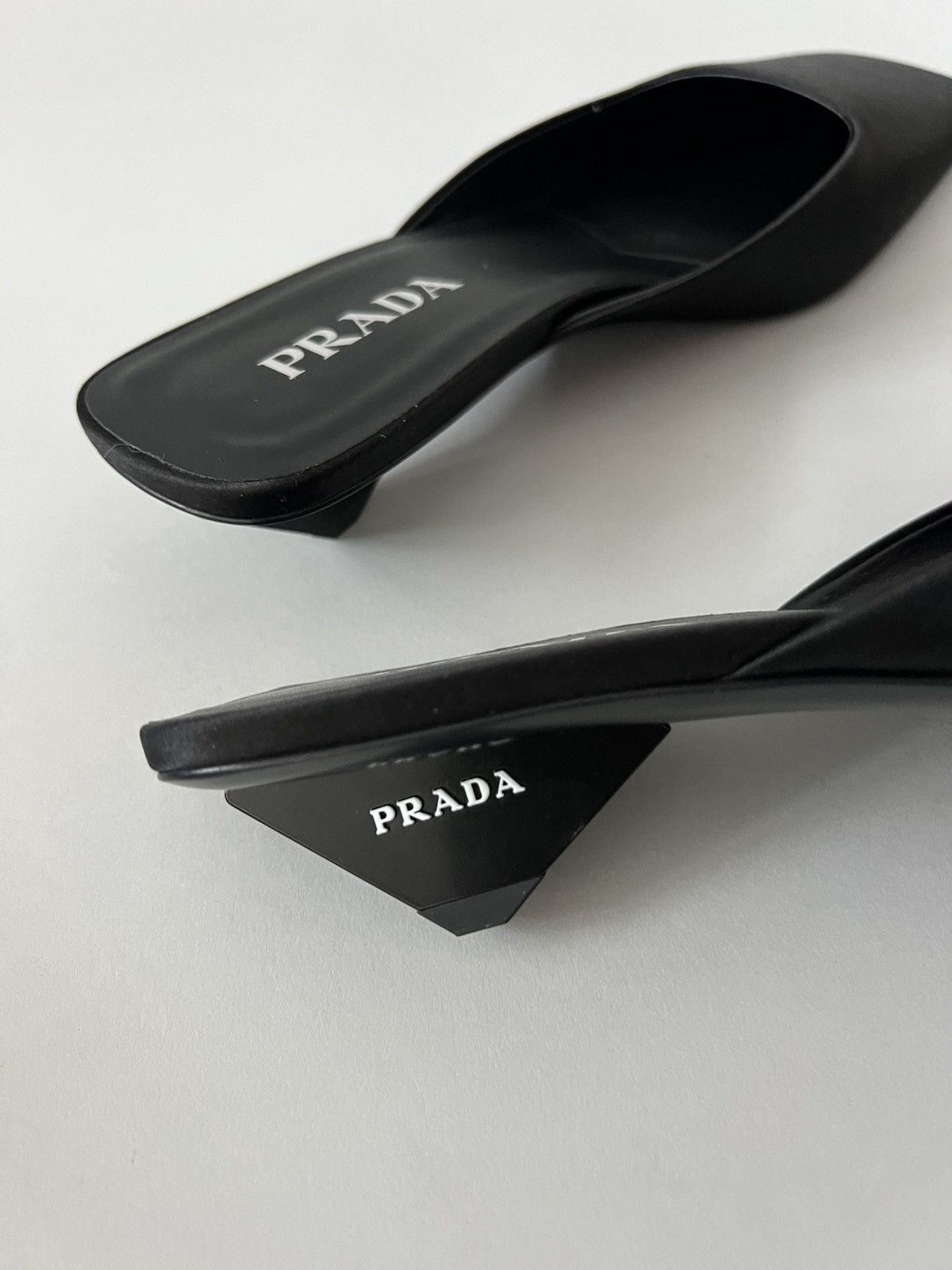 $1.4K VALUE Prada Satin Square Toe Mule Sandals in black