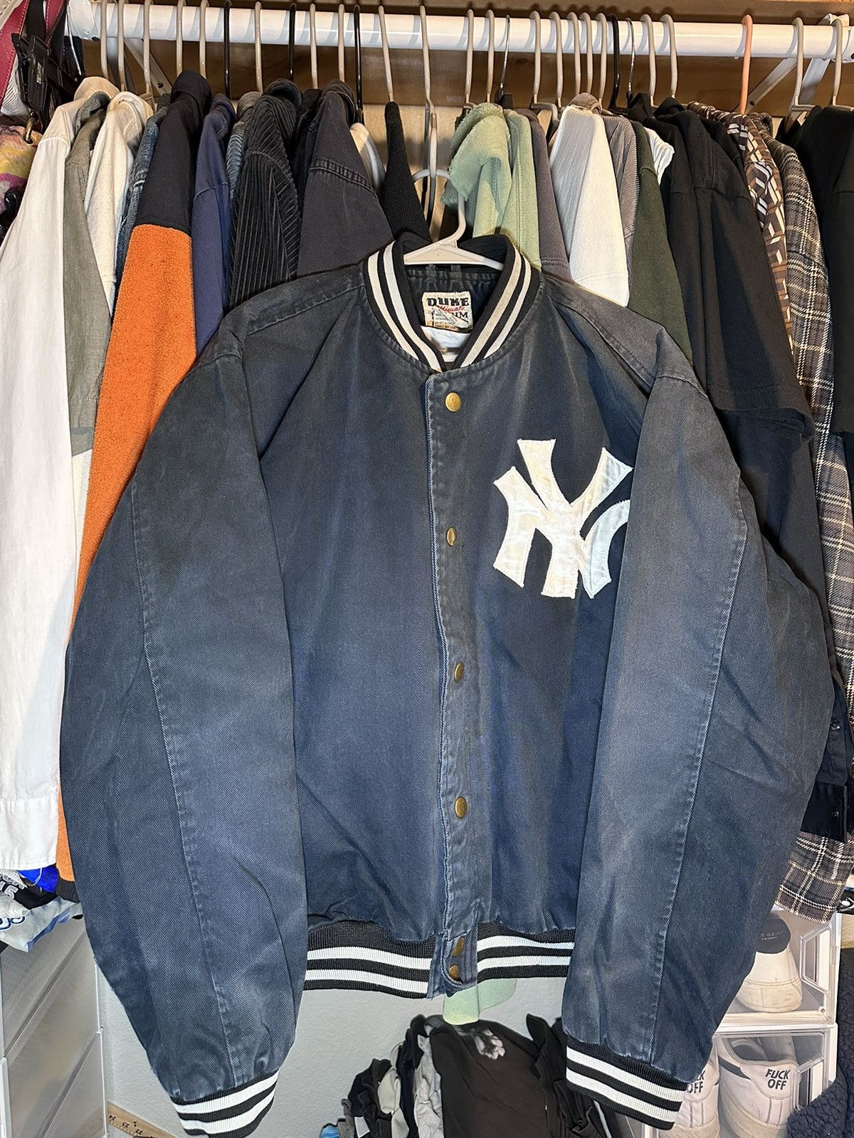 A vintage New York Yankees jacket being cleaned and stored properly