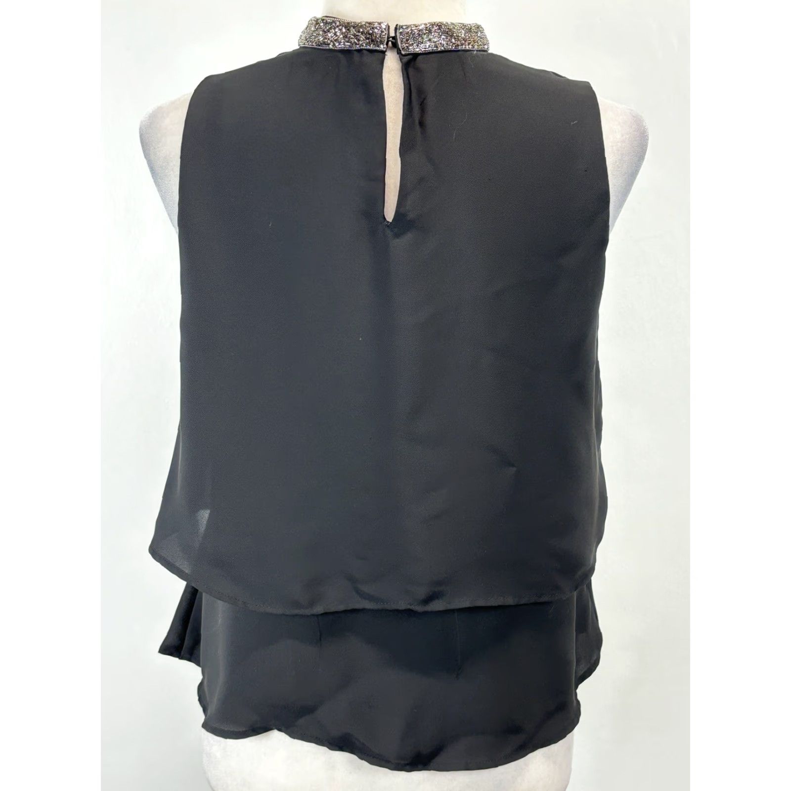 Zara VINTAGE? No. But we have Zara Basic Black Sleeveless Tiered Blouse with Silver Collar, Women, Size Small, Black, Sleeveless, Collared, Blouse. Size S / US 4 / IT 40 - 3 Thumbnail