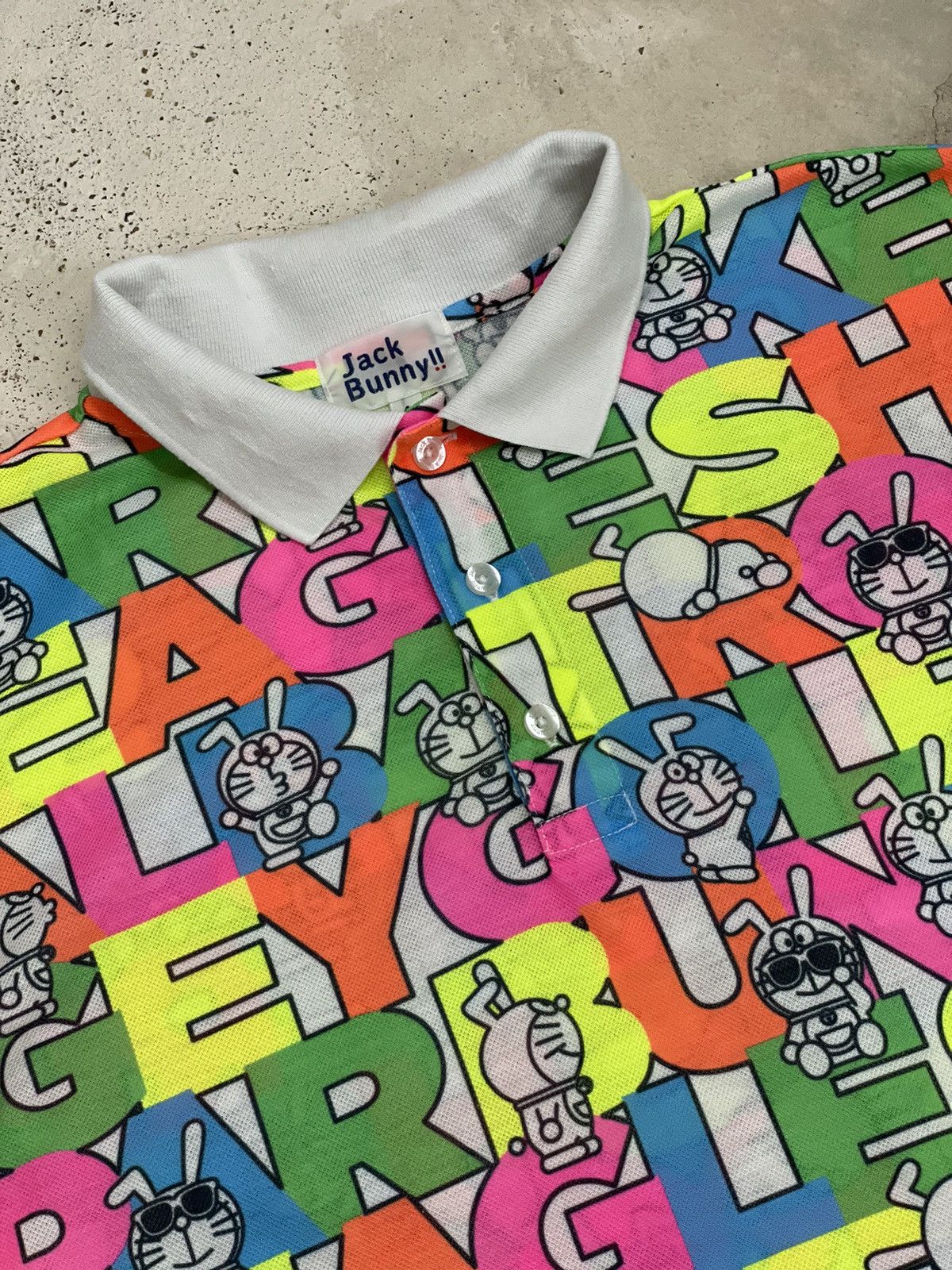 Anime × Japanese Brand × Psycho Bunny Jack Bunny Doraemon Polo Fullprint Wording Colorful Size US L / EU 52-54 / 3 - 6 Thumbnail