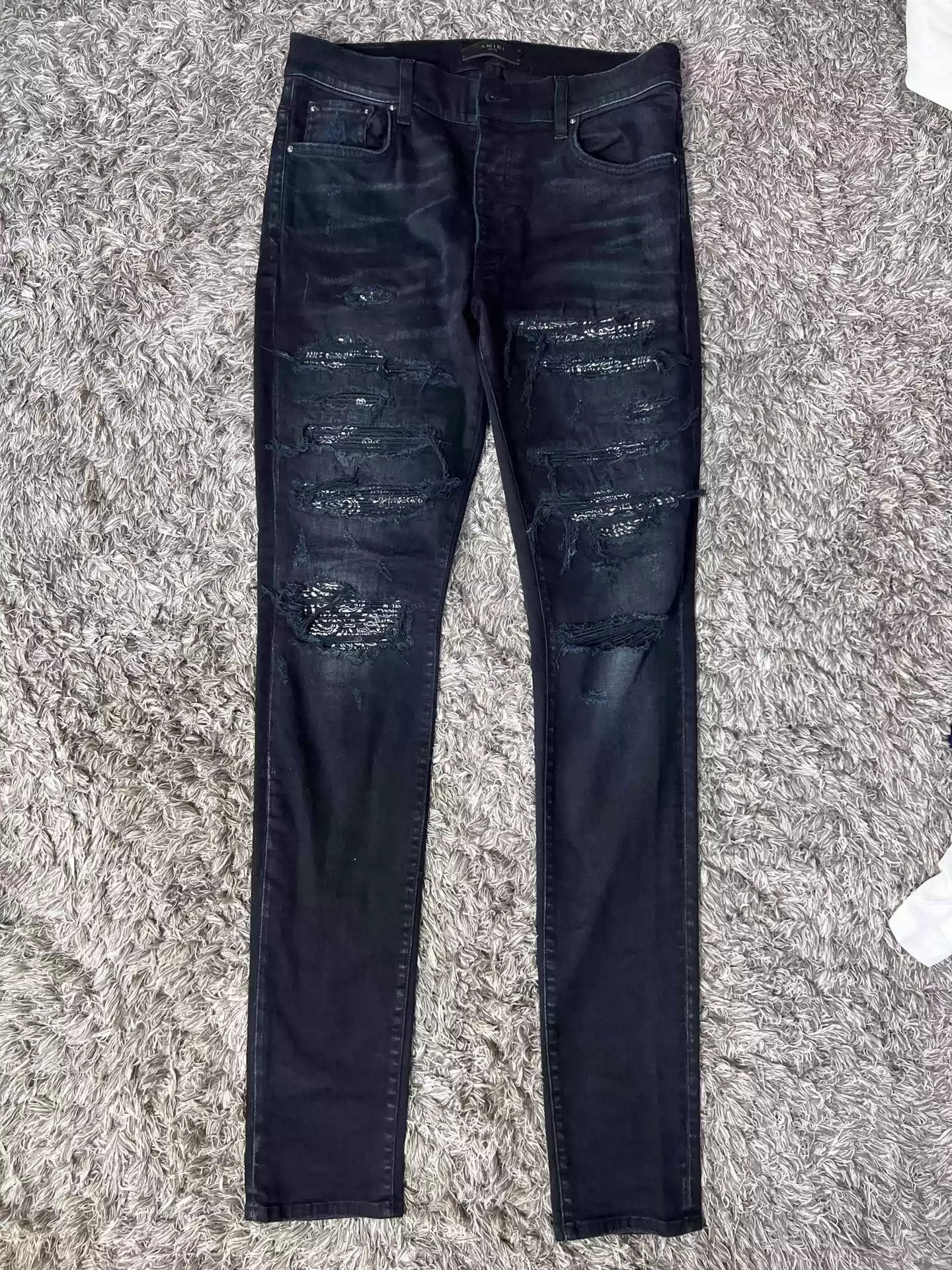 image of Amiri Blue Cashew Flower Knife Cut Ripped Jeans in Black, Men's (Size 32)