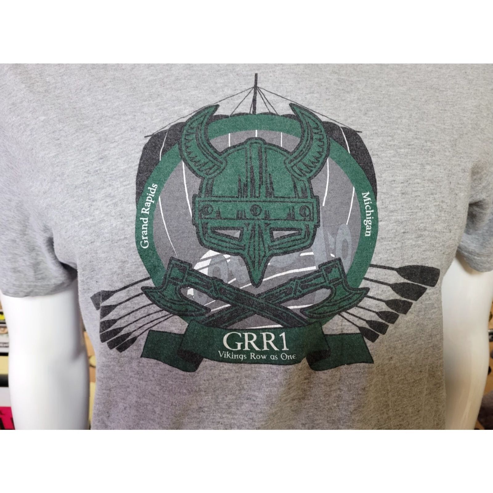 Vintage VINTAGE Grand Rapids Gerald Ford Airport Vikings Row As One T Shirt Medium Gray District Mens Crew Neck Short Sleeve Graphic Tee Work Theme 90s? Size US M / EU 48-50 / 2 - 2 Thumbnail