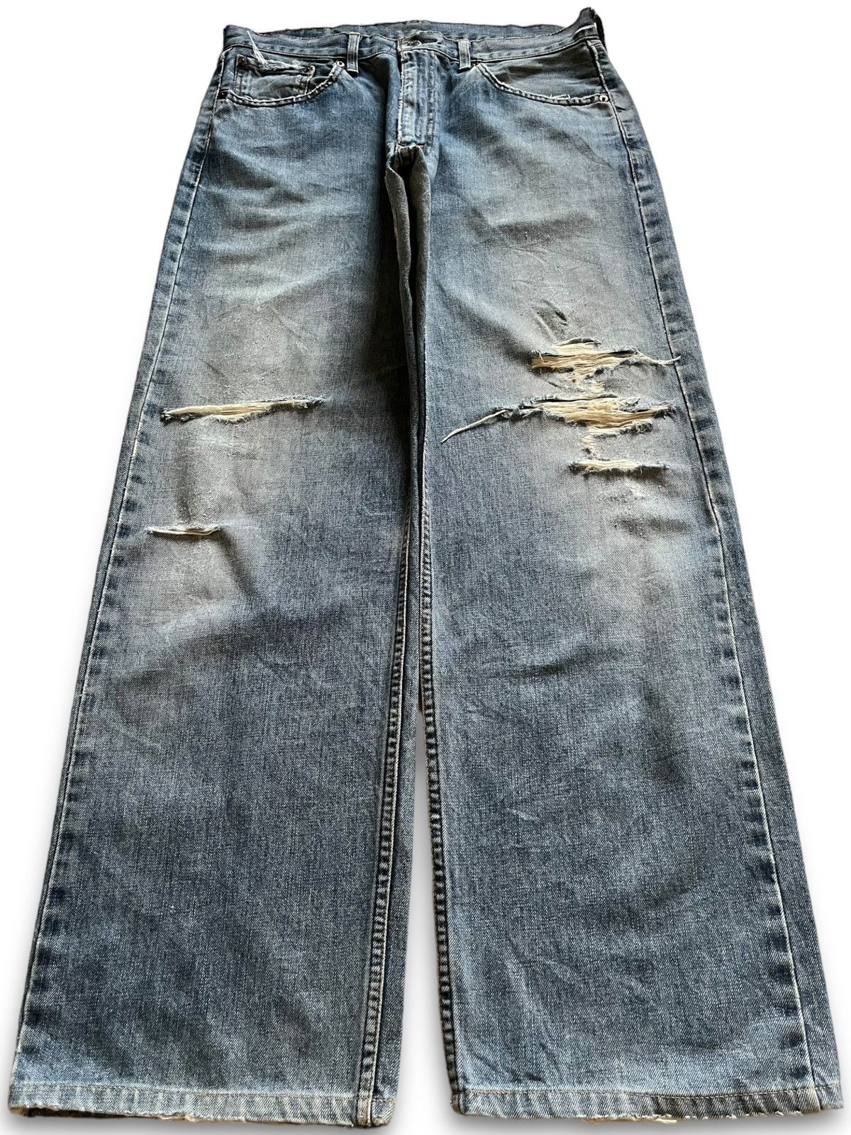 image of Distressed Denim x Levis Vintage 90's Levis 515 Faded Wash Distressed Baggy Jeans in Blue (Size 33)