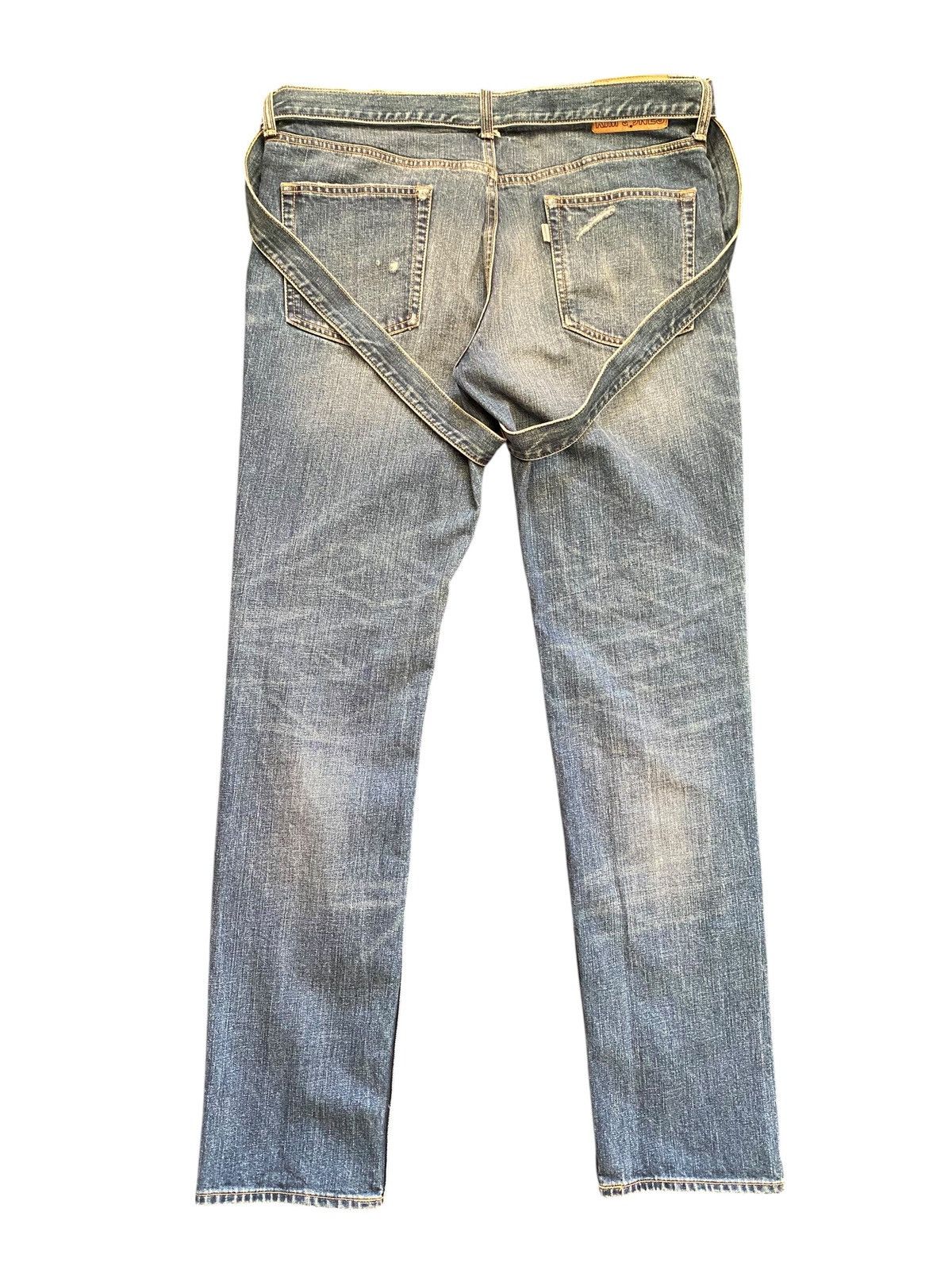 Kim Jones x GU distressed bondage denim