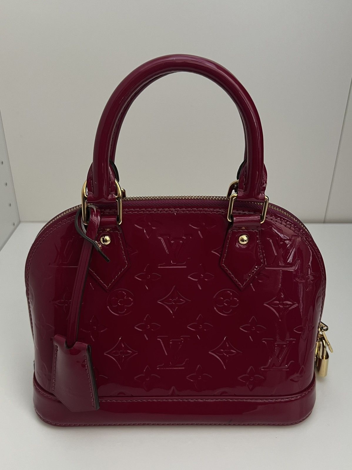 image of Louis Vuitton Alma Bb in Magenta, Women's