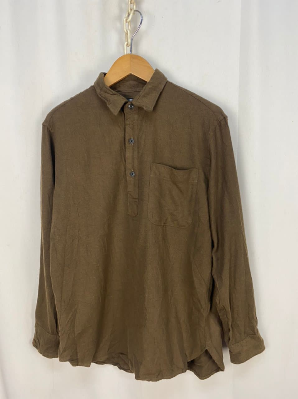 Uniqlo half button up single pocket shirt