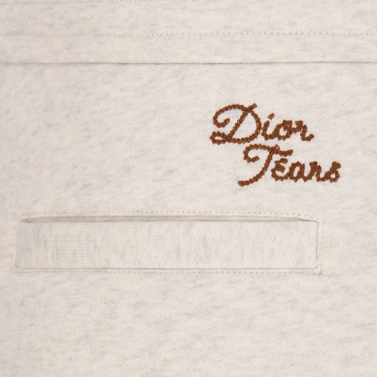o1bcso1str0225 Tears Track Shorts in Ecru