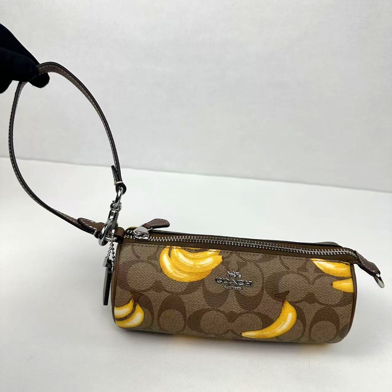 Coach Cr368 Nolita Barrel Bag In Signature Canvas Khaki/dark in Brown, Women's